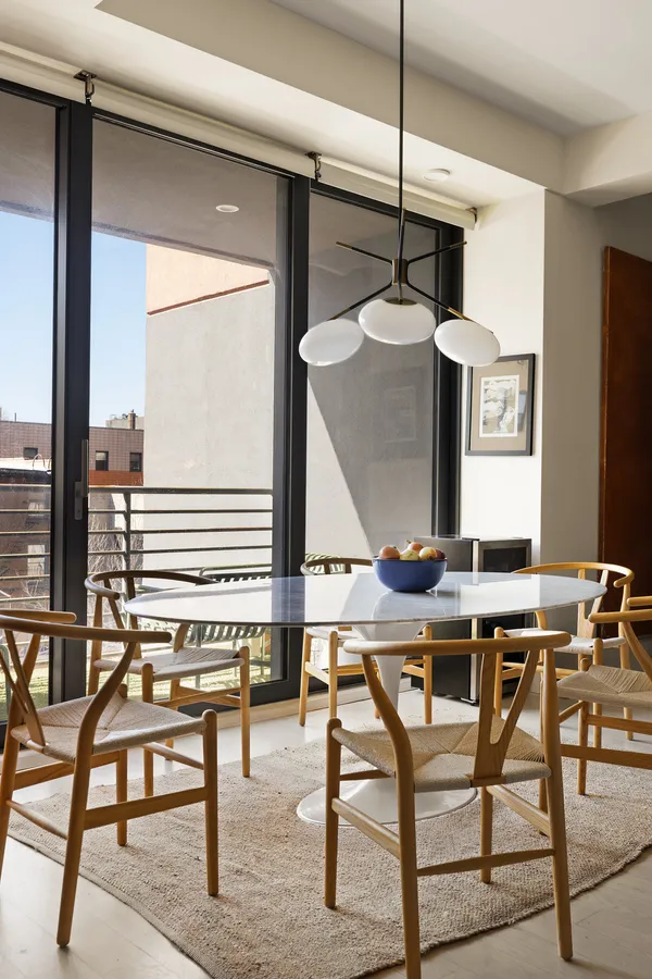 a view of an chairs and table in a room