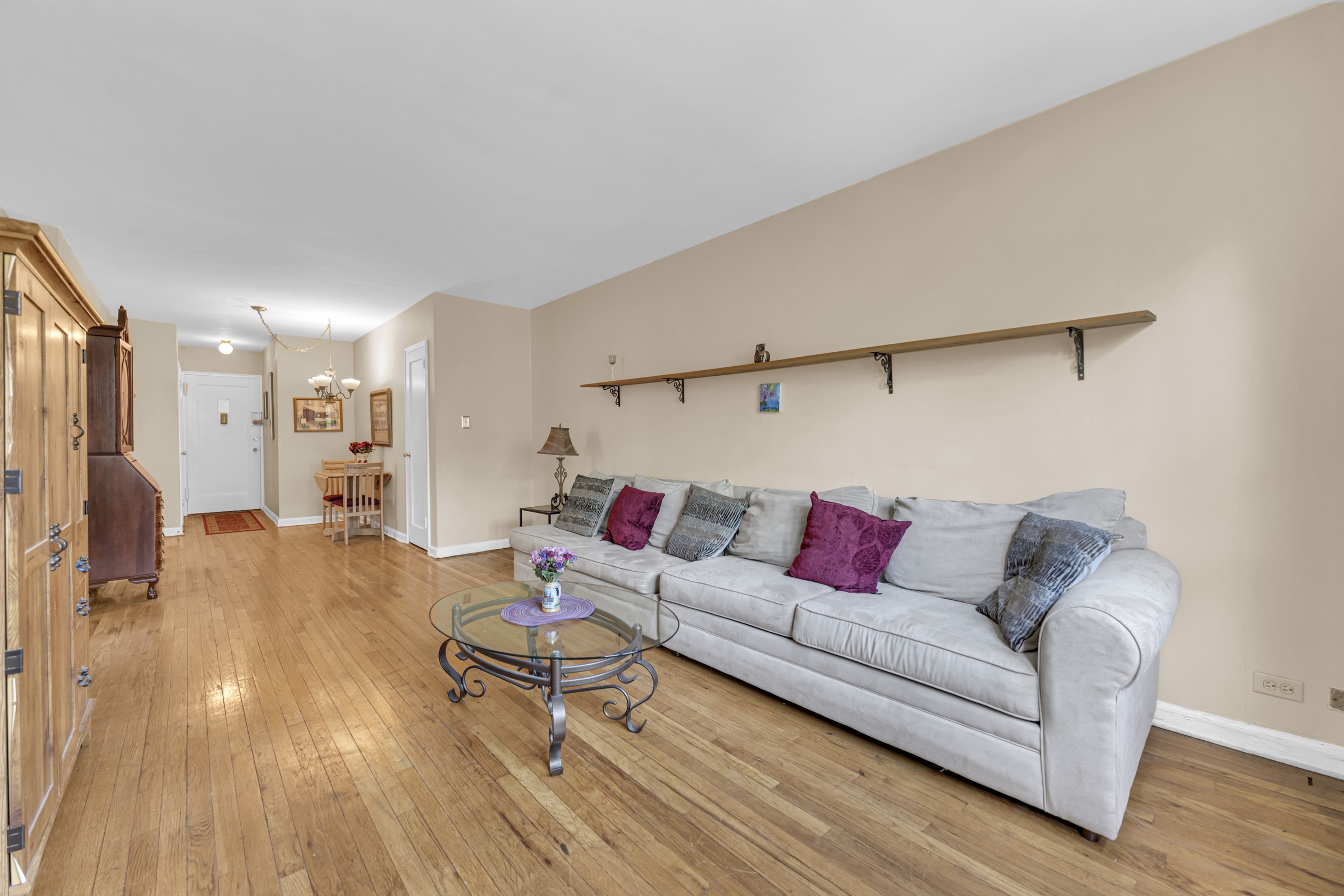 5614 Netherland Avenue, Unit 3E Bronx, NY 10471 - Photo 2 of 13 a living room with furniture and a wooden floor