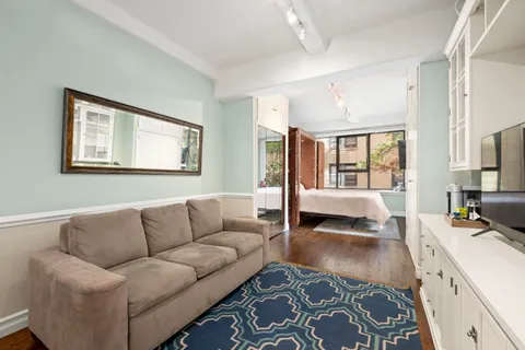 a living room with furniture and a couch