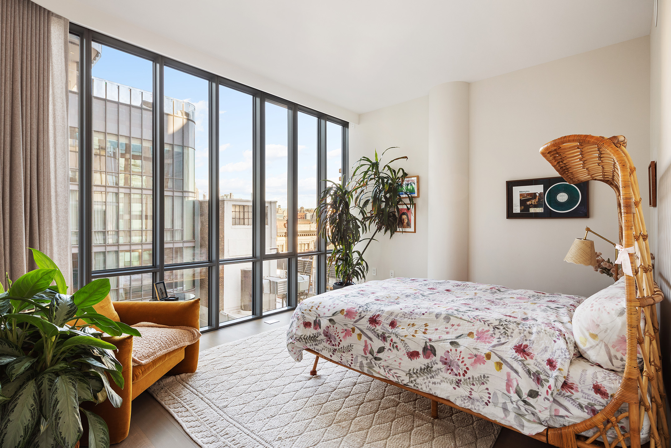565 Broome Street, Unit S11E Manhattan, NY 10013 - Photo 9 of 11 a bedroom with a balcony a bed and a couch
