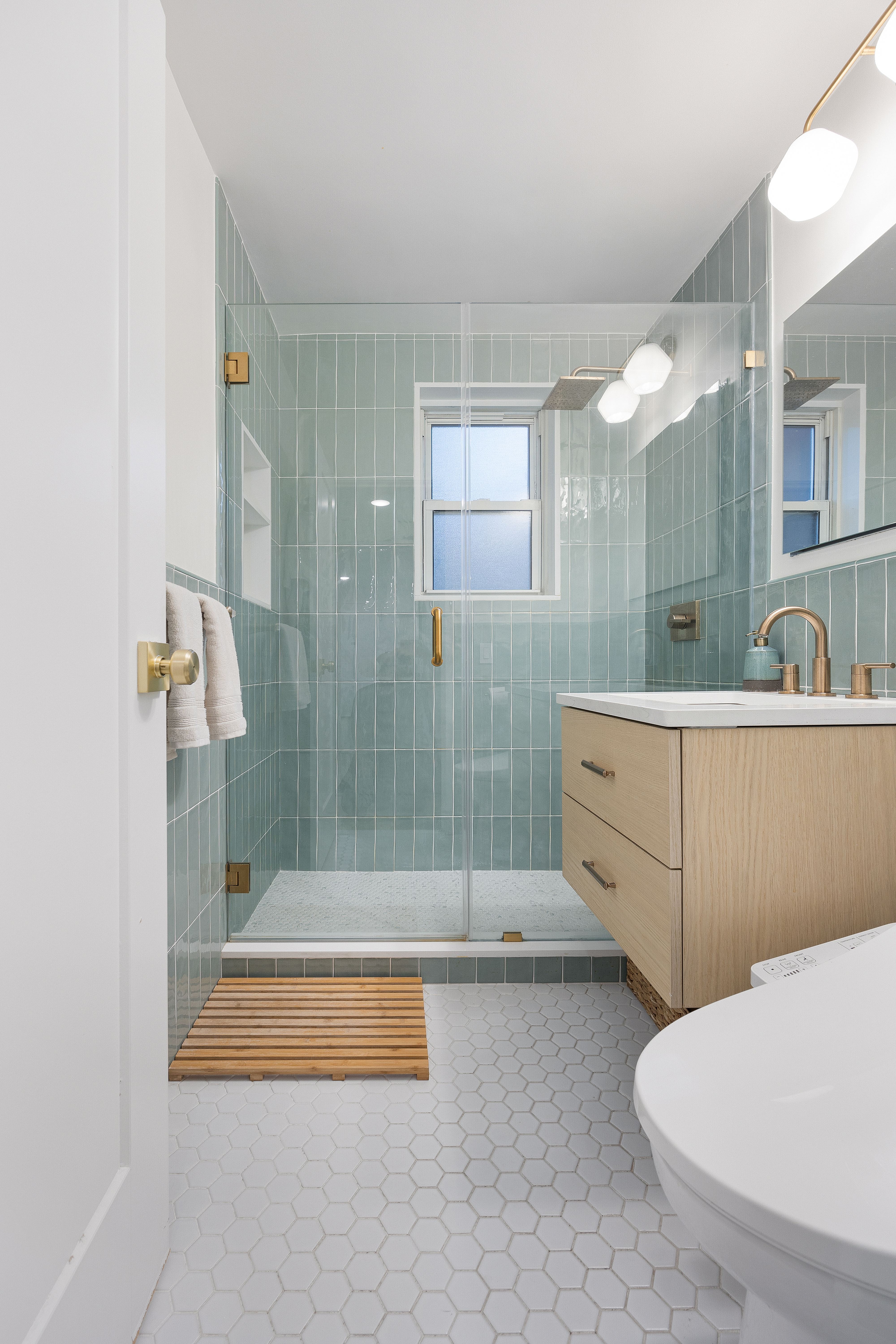 333 East 79th Street, Unit 18N Manhattan, NY 10075 - Photo 9 of 11 a bathroom with a tub sink and mirror