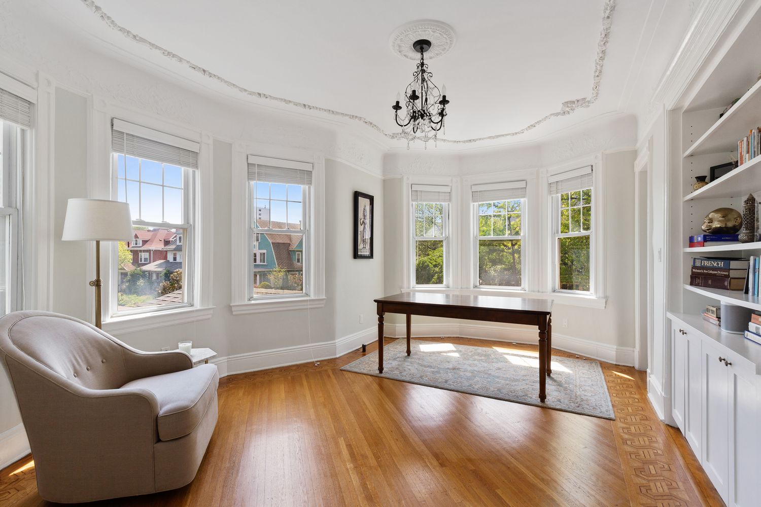 685 East 22nd Street Brooklyn, NY 11210 - Photo 20 of 43 a living room with furniture and a wooden floor