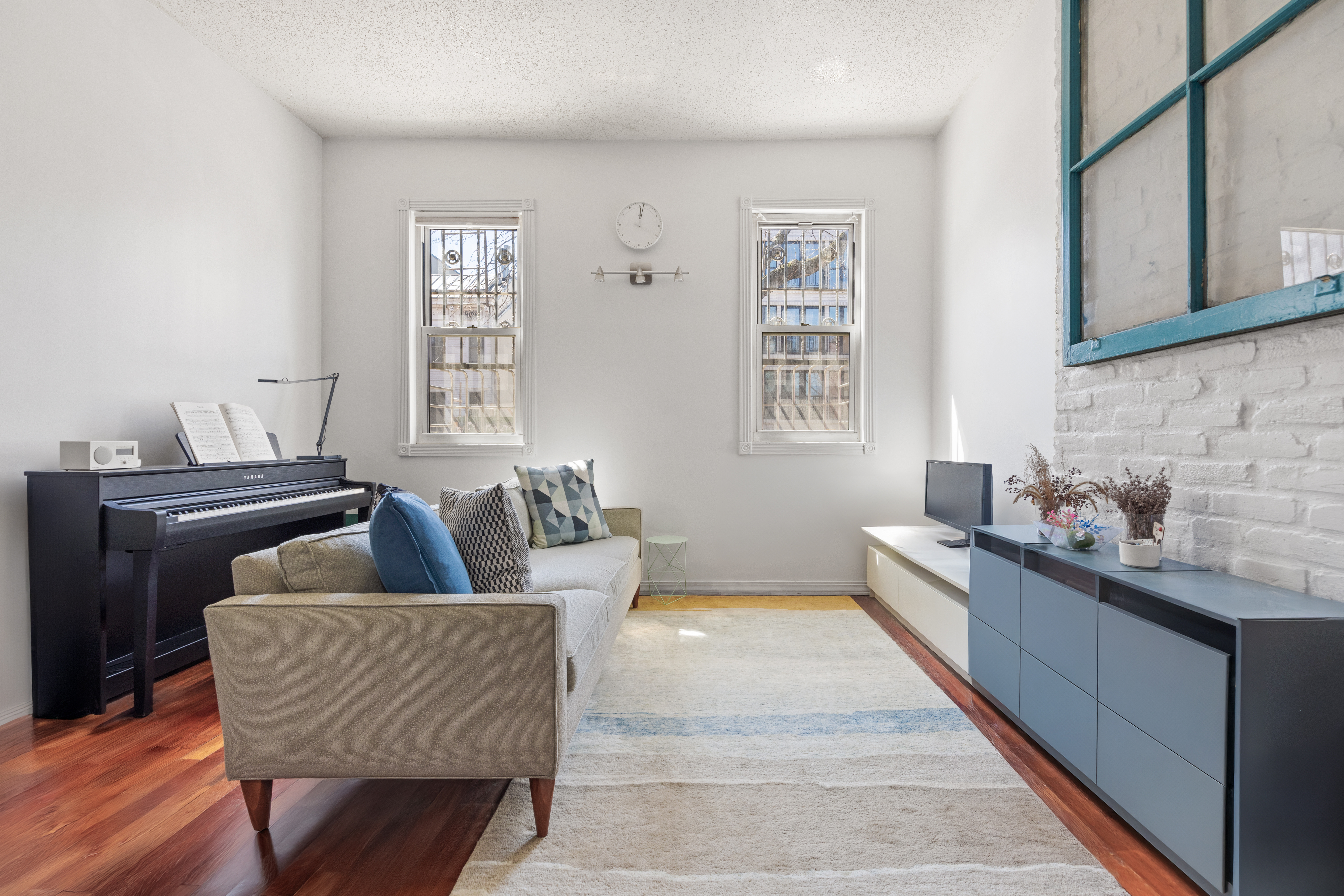 219 16th Street, Unit 1 Brooklyn, NY 11215 - Photo 2 of 7 a living room with furniture and a couch