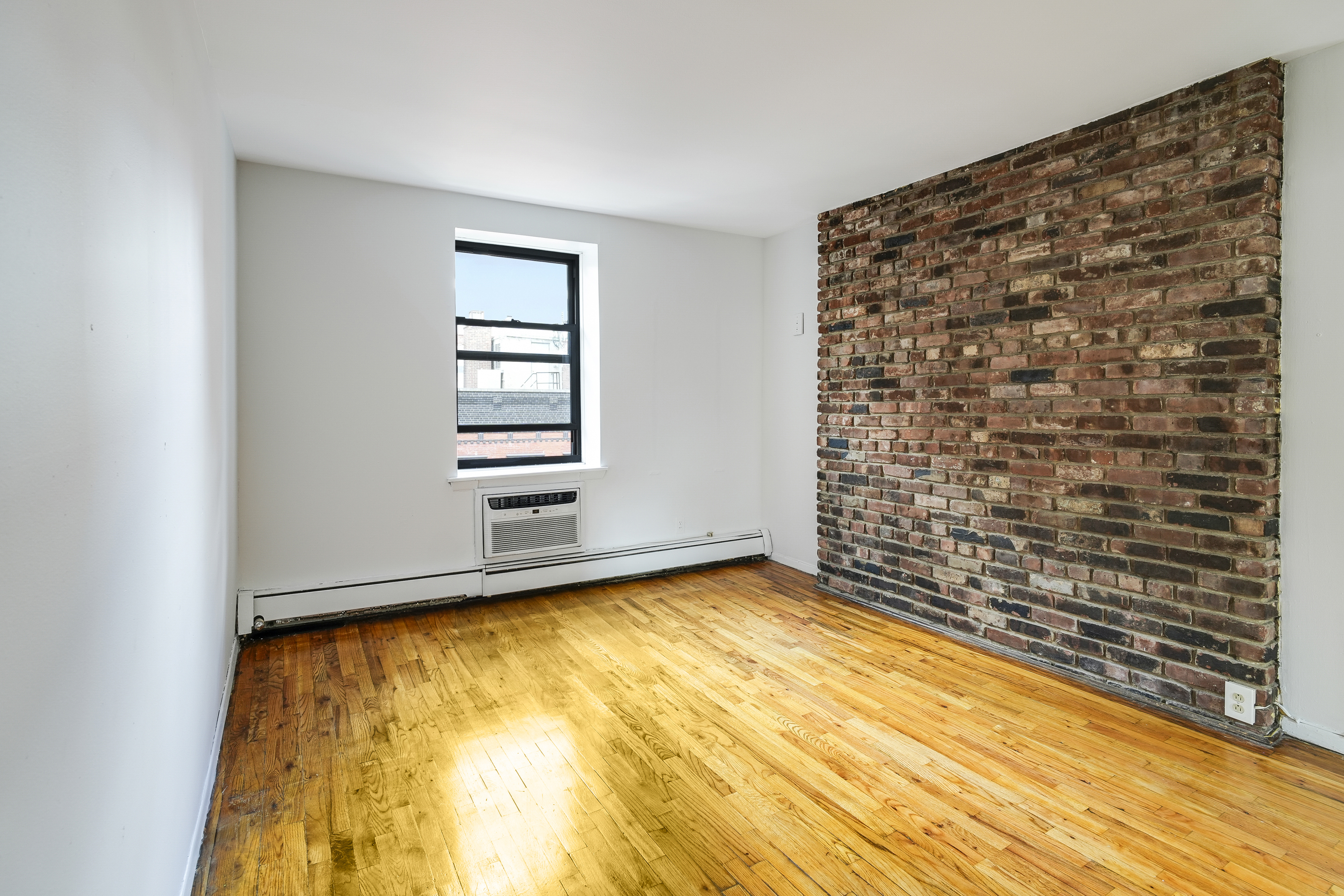 160 East 26th Street, Unit 5F Manhattan, NY 10010 - Photo 2 of 10 a view of an empty room with a window