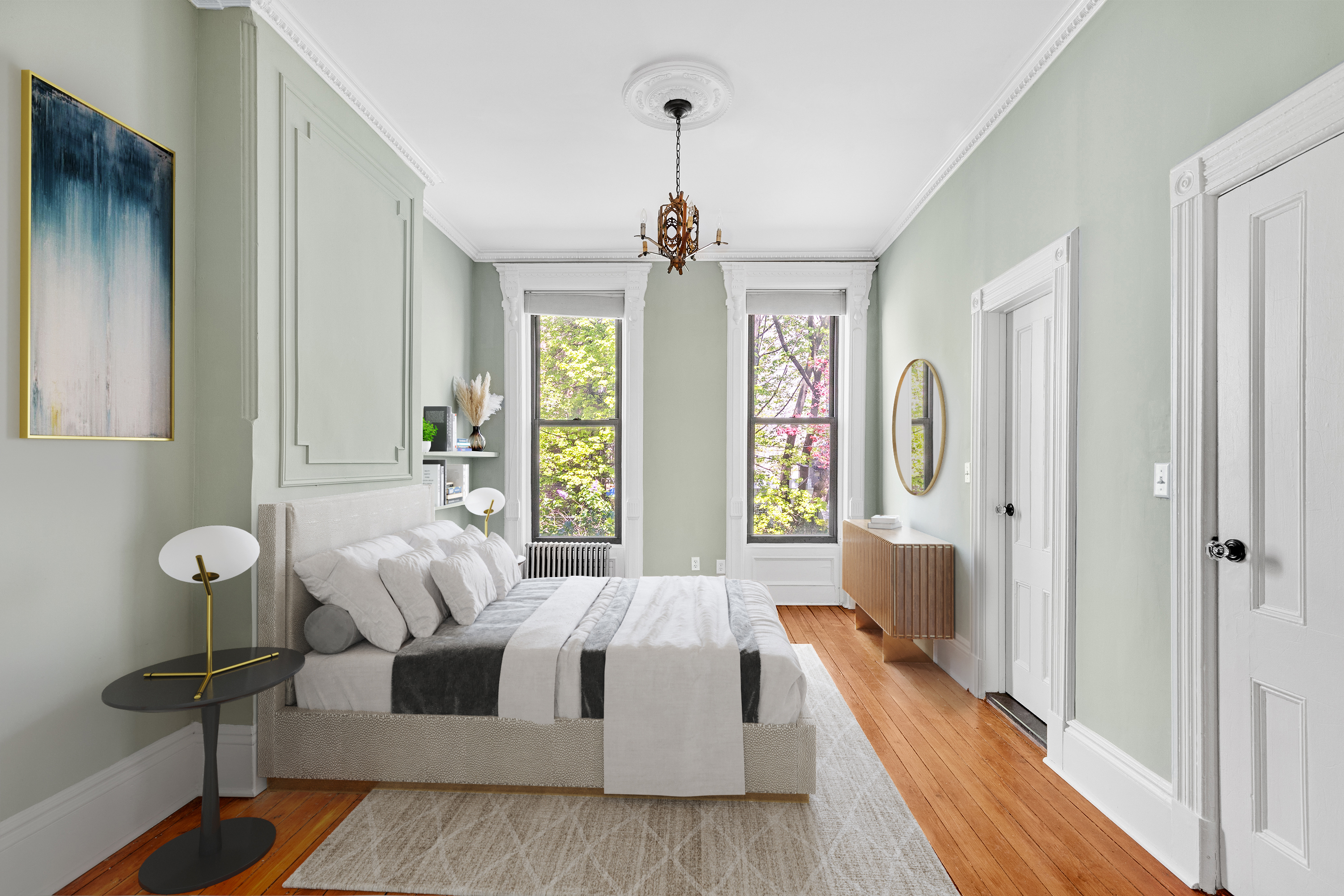 955 Bushwick Avenue Brooklyn, NY 11221 - Photo 3 of 19 a spacious bedroom with a bed and a chandelier