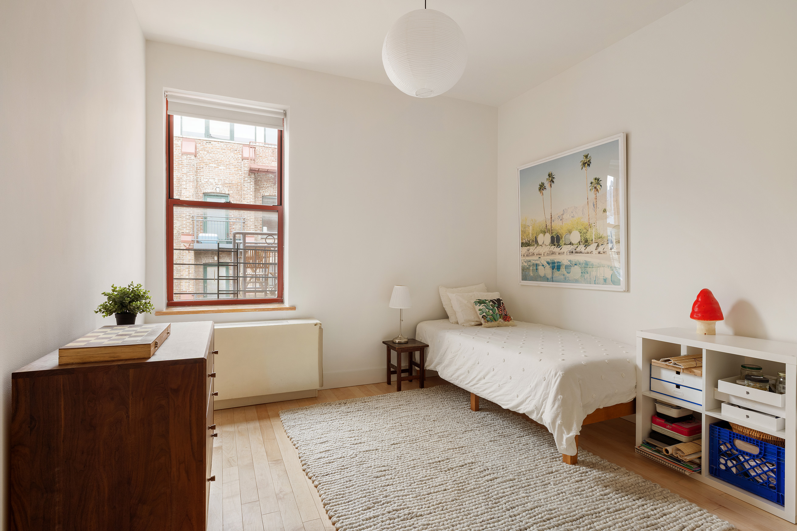 60 Tiffany Place, Unit 3G Brooklyn, NY 11231 - Photo 7 of 10 a bedroom with a bed and a window