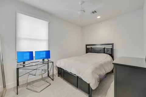 a bedroom with a bed and window