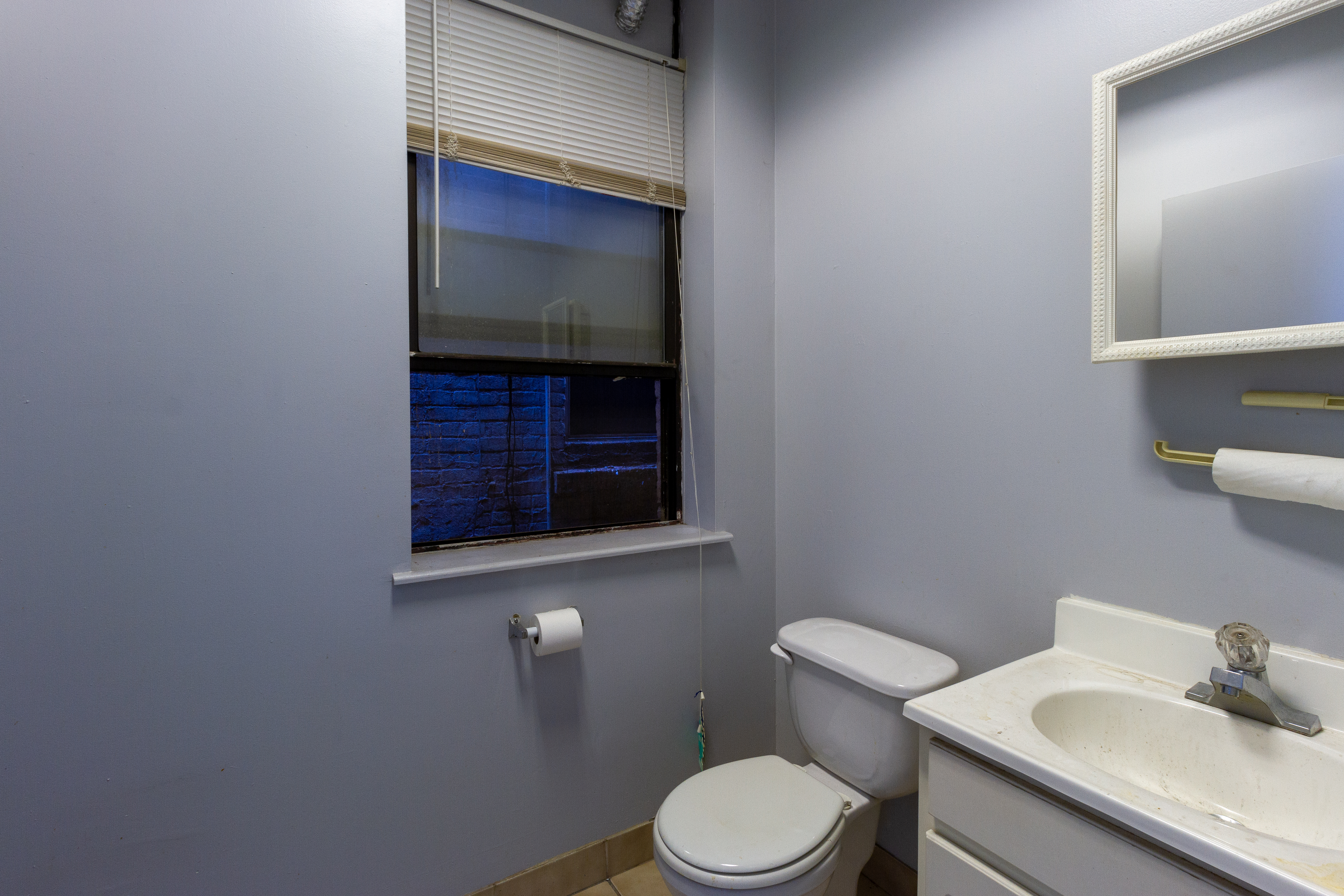 22 4th Avenue Brooklyn, NY 11217 - Photo 10 of 12 a bathroom with a toilet a sink and mirror