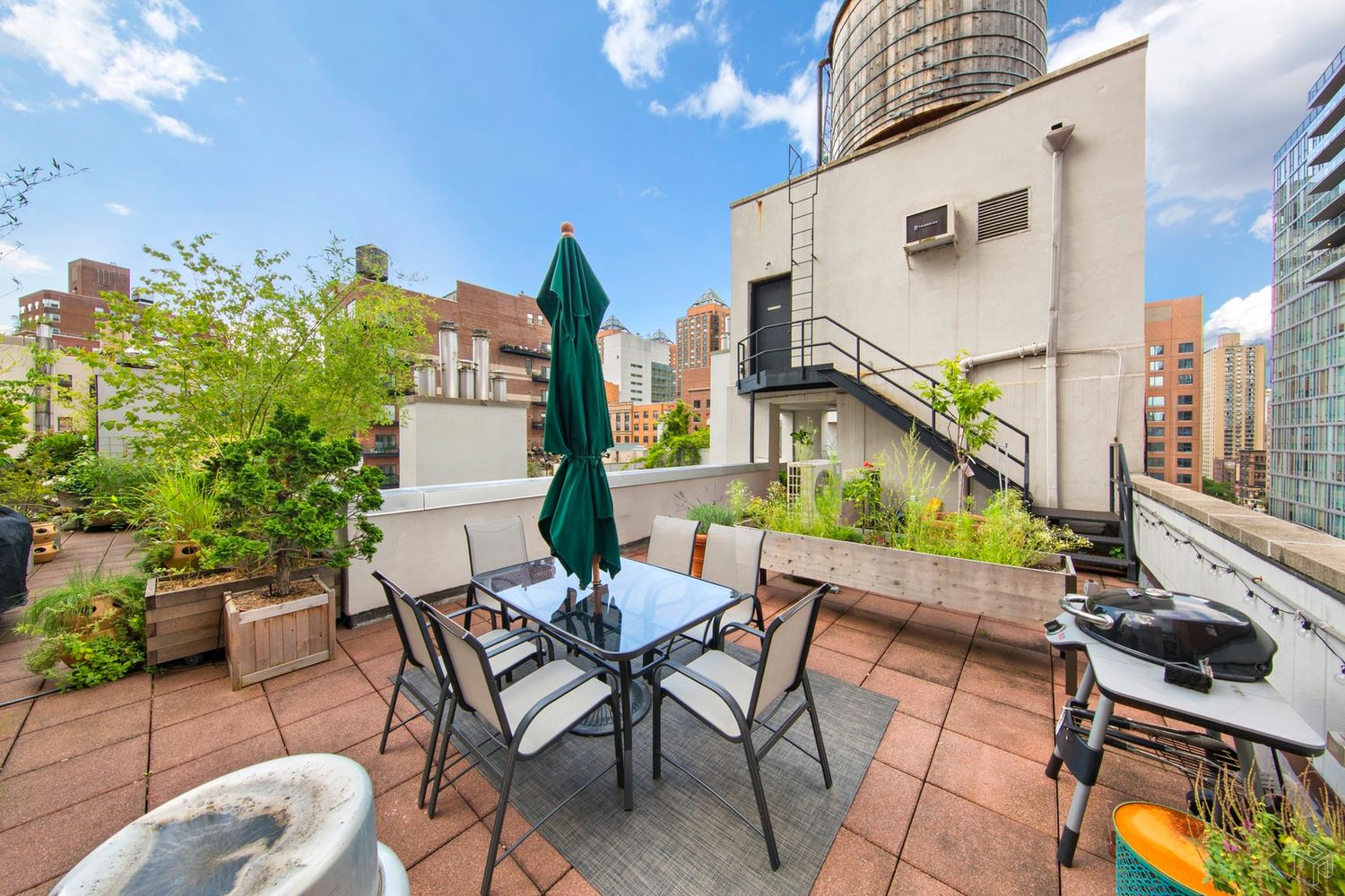 125 East 12th Street, Unit 2G Manhattan, NY 10003 - Photo 8 of 11 a view of an chairs and tables in the back yard of the house