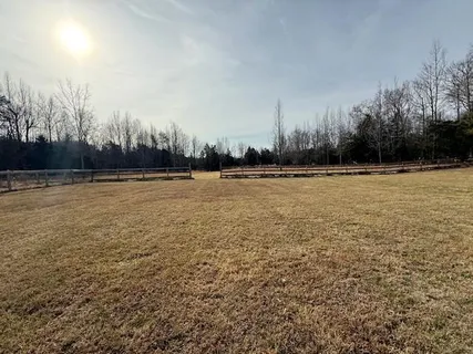 a view of a swimming pool and an outdoor seating
