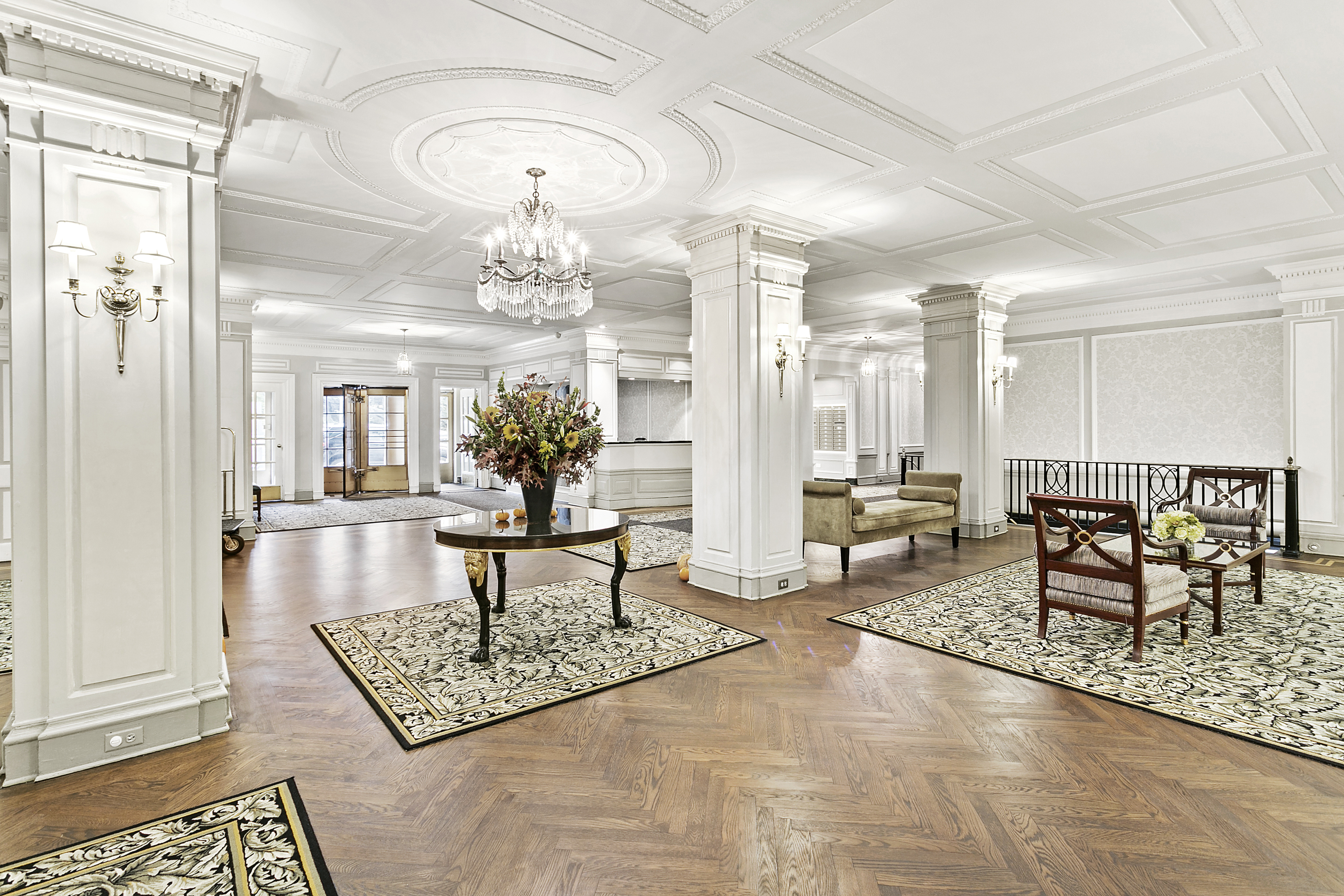 225 Central Park West, Unit 801 Manhattan, NY 10024 - Photo 16 of 21 a living room with furniture a table and a chandelier