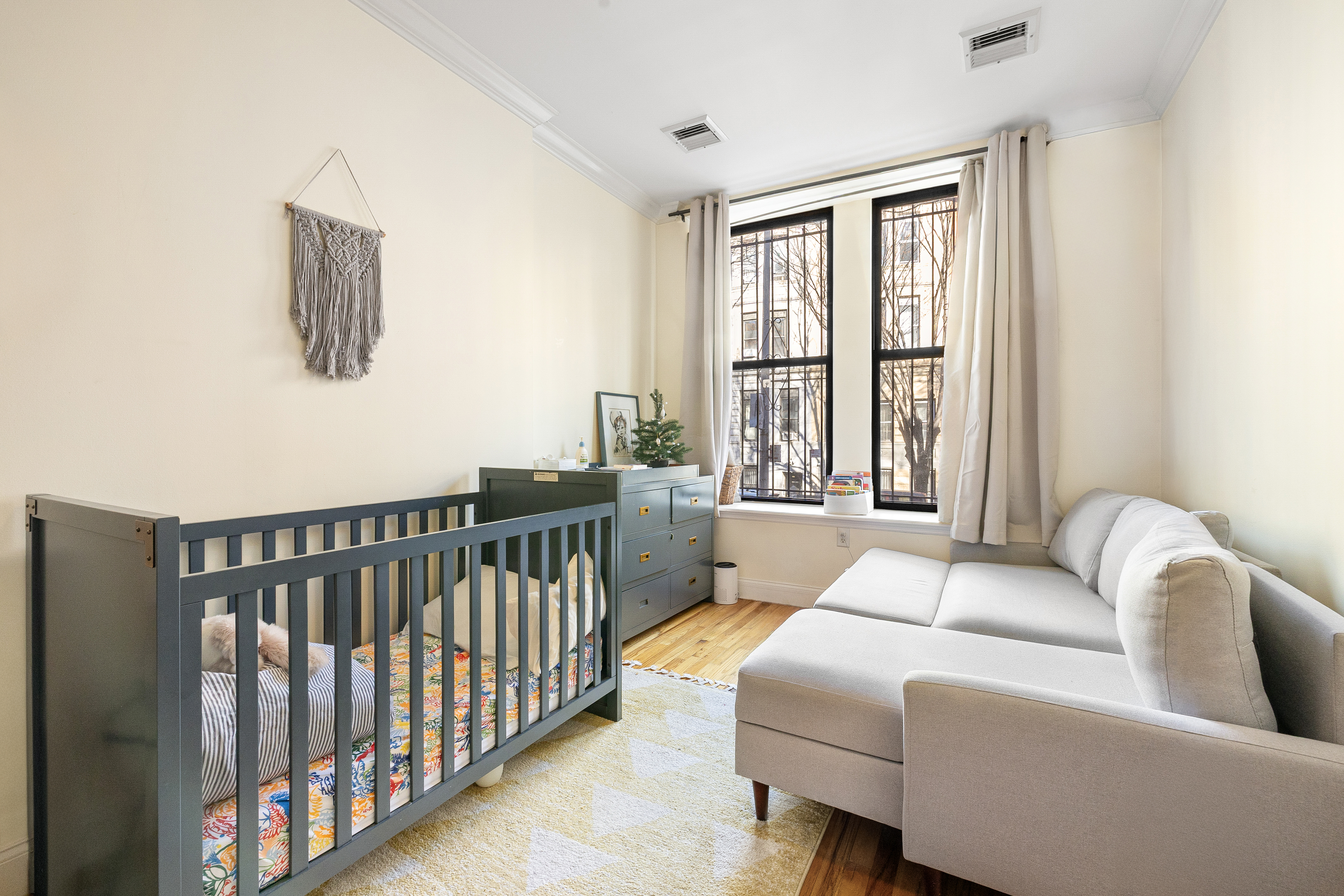 518 West 149th Street Manhattan, NY 10031 - Photo 8 of 23 a living room with furniture and a window