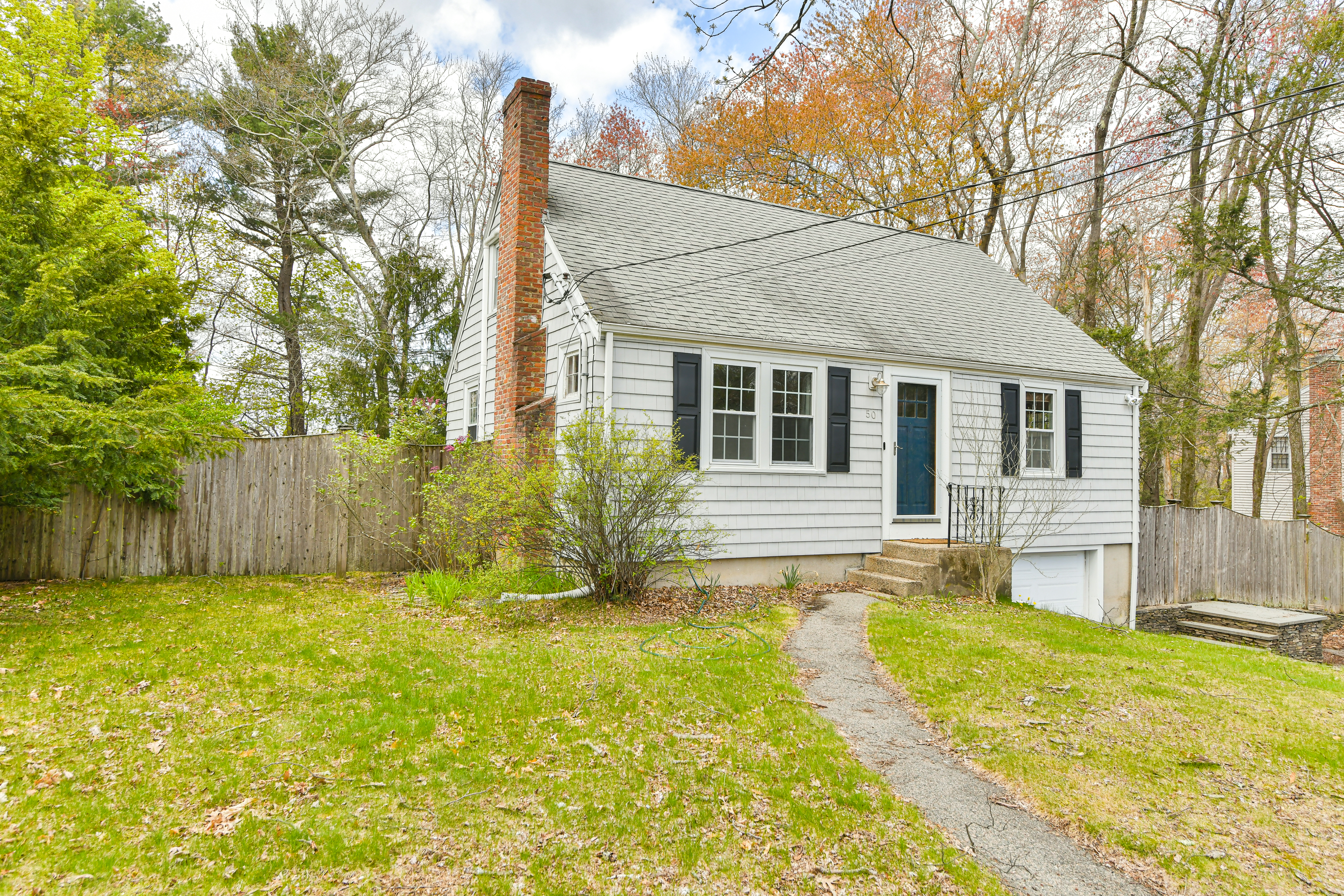 50 Rustic Road Walpole, MA 02032 - Photo 11 of 16 a view of a house with a swimming pool
