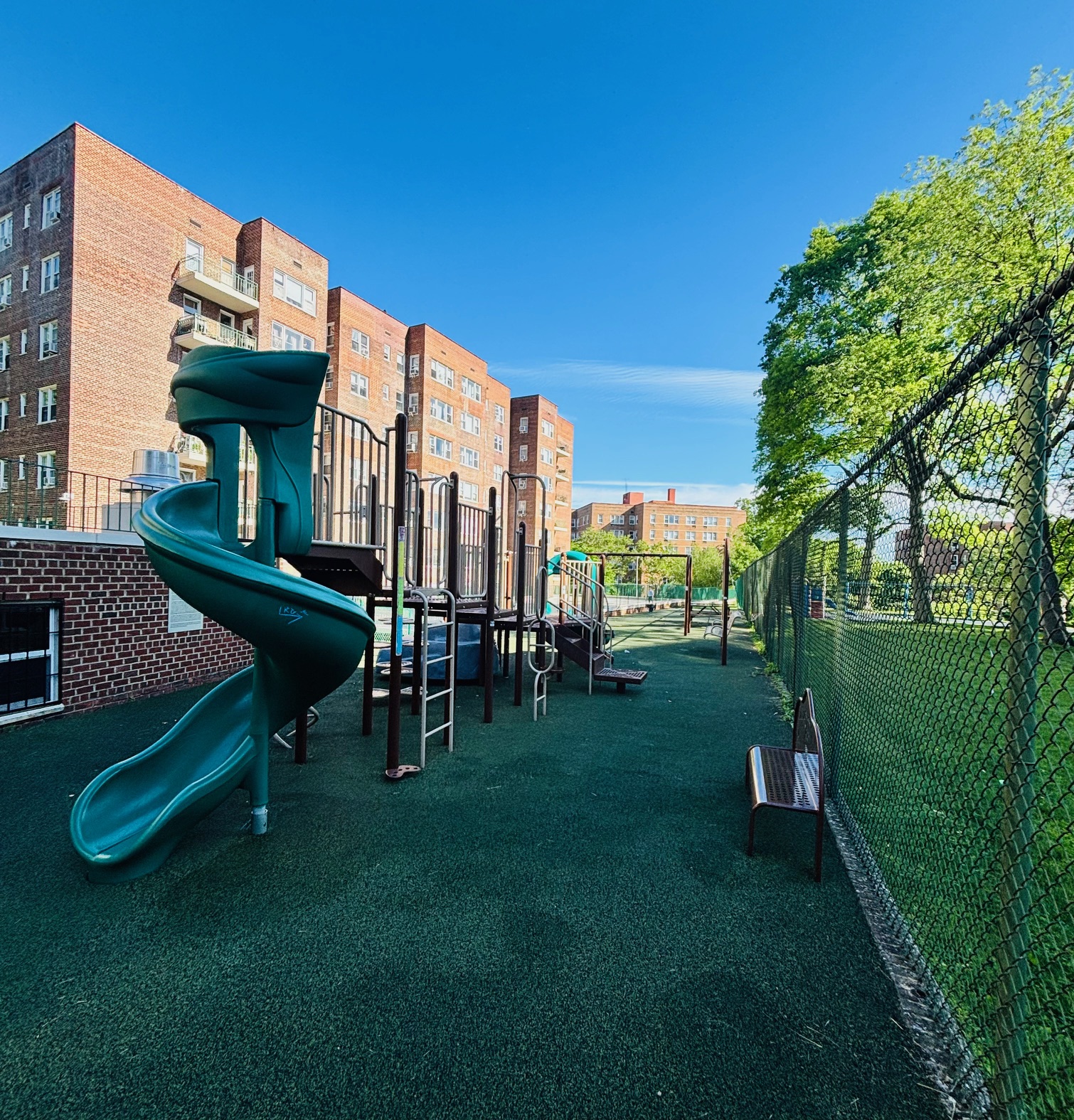 3850 Hudson Manor Terrace, Unit 1EE/2EE Bronx, NY 10463 - Photo 25 of 27 a view of a chair and table in the garden