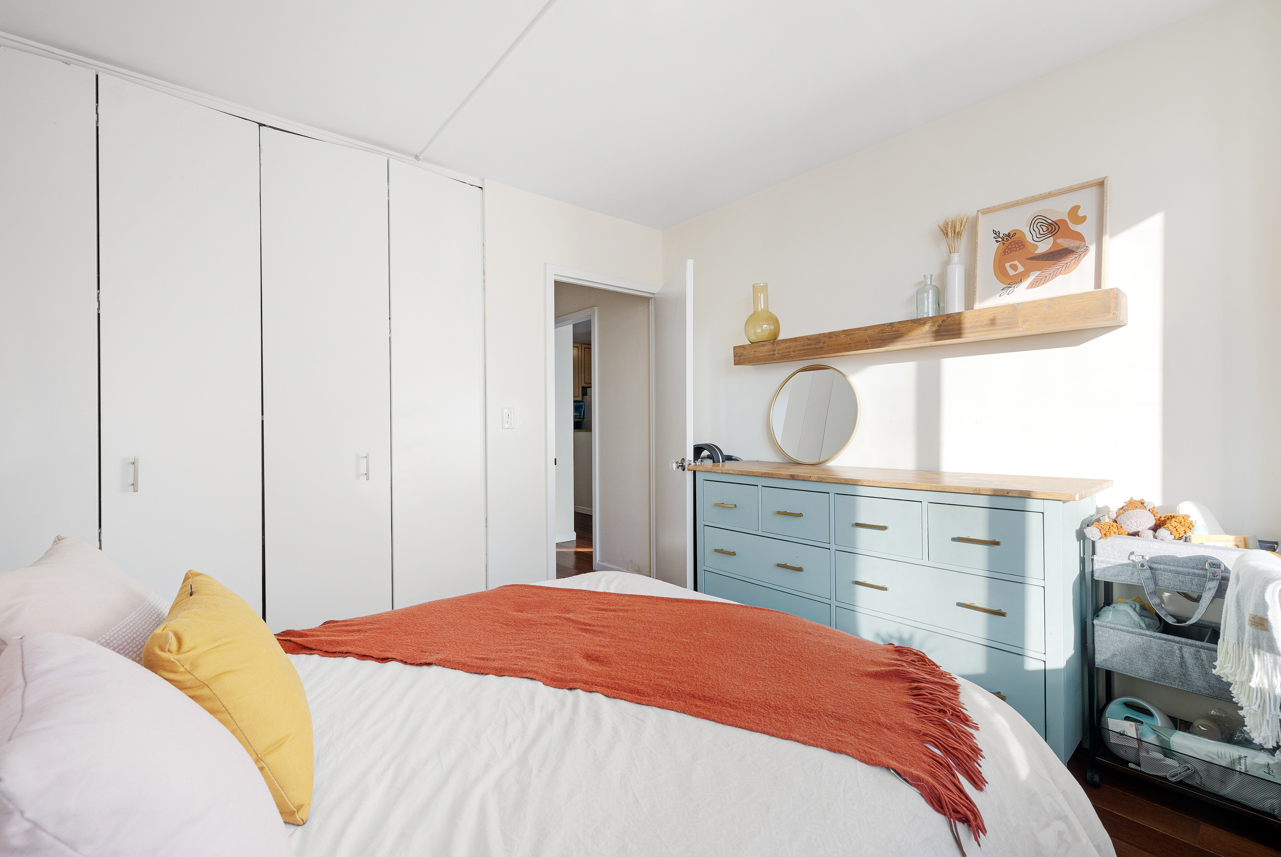 2025 Broadway, Unit 9F Manhattan, NY 10023 - Photo 6 of 11 a bedroom with a bed and a dresser