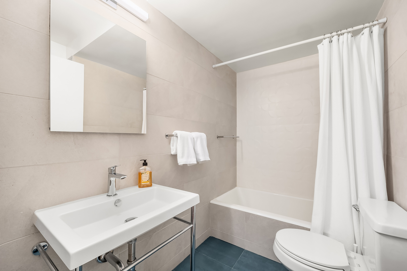 2166 Broadway, Unit 5D Manhattan, NY 10024 - Photo 10 of 11 a bathroom with a sink toilet and shower