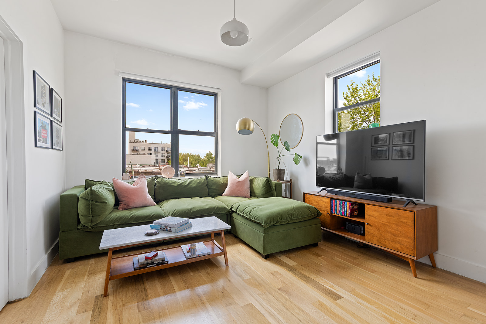a living room with furniture and a flat screen tv