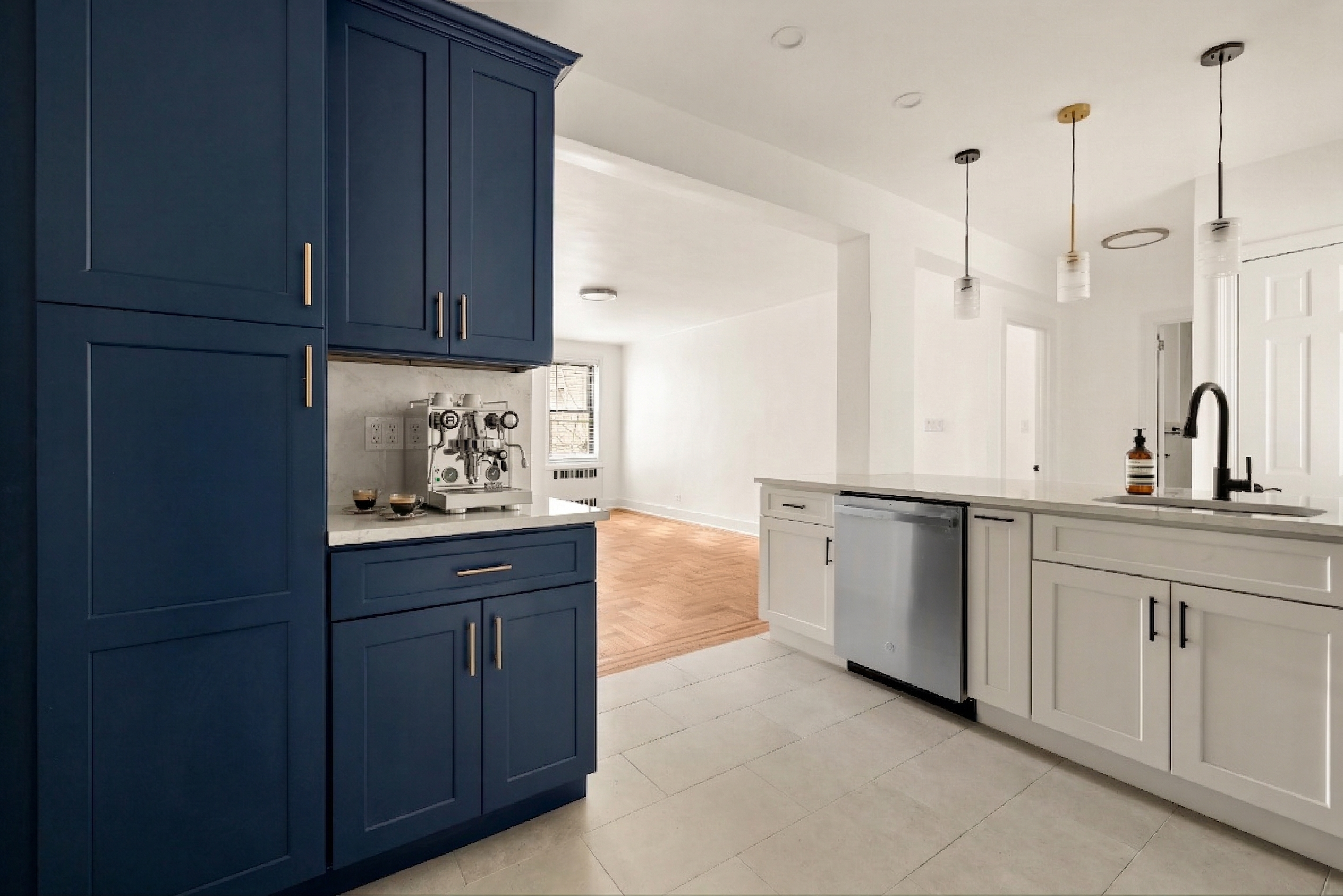 47-39 40th Street, Unit 1B Queens, NY 11104 - Photo 4 of 15 a kitchen with stainless steel appliances granite countertop a sink a stove and cabinets