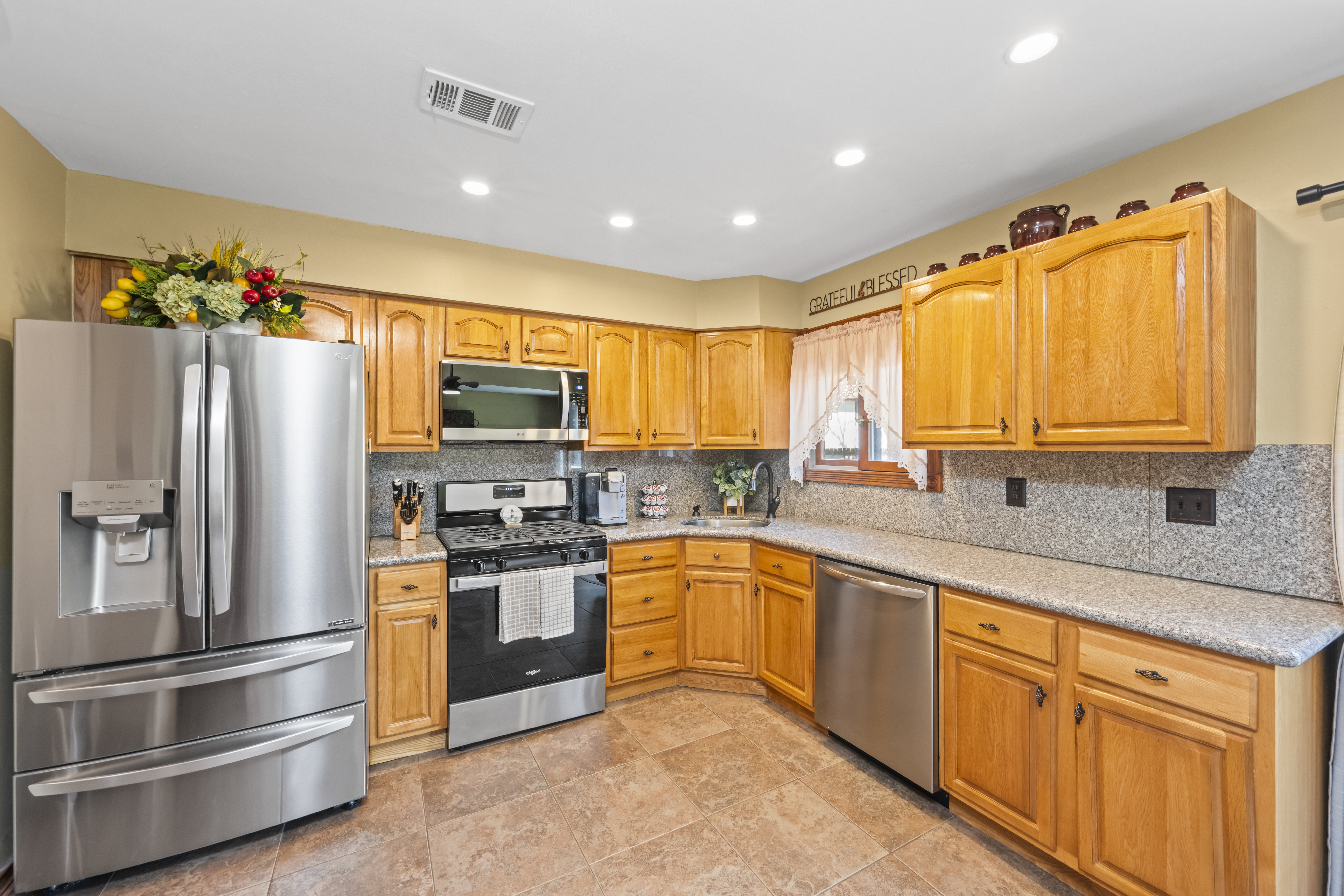 15 Hickory Circle Staten Island, NY 10312 - Photo 13 of 40 a kitchen with stainless steel appliances granite countertop a refrigerator and a stove top oven