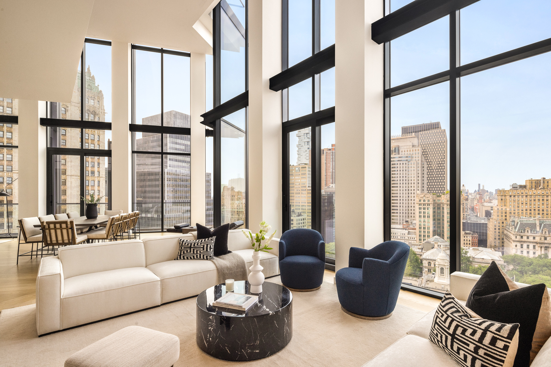 33 Park Row, Unit PH3 Manhattan, NY 10038 - Photo 10 of 30 a living room with furniture and large windows