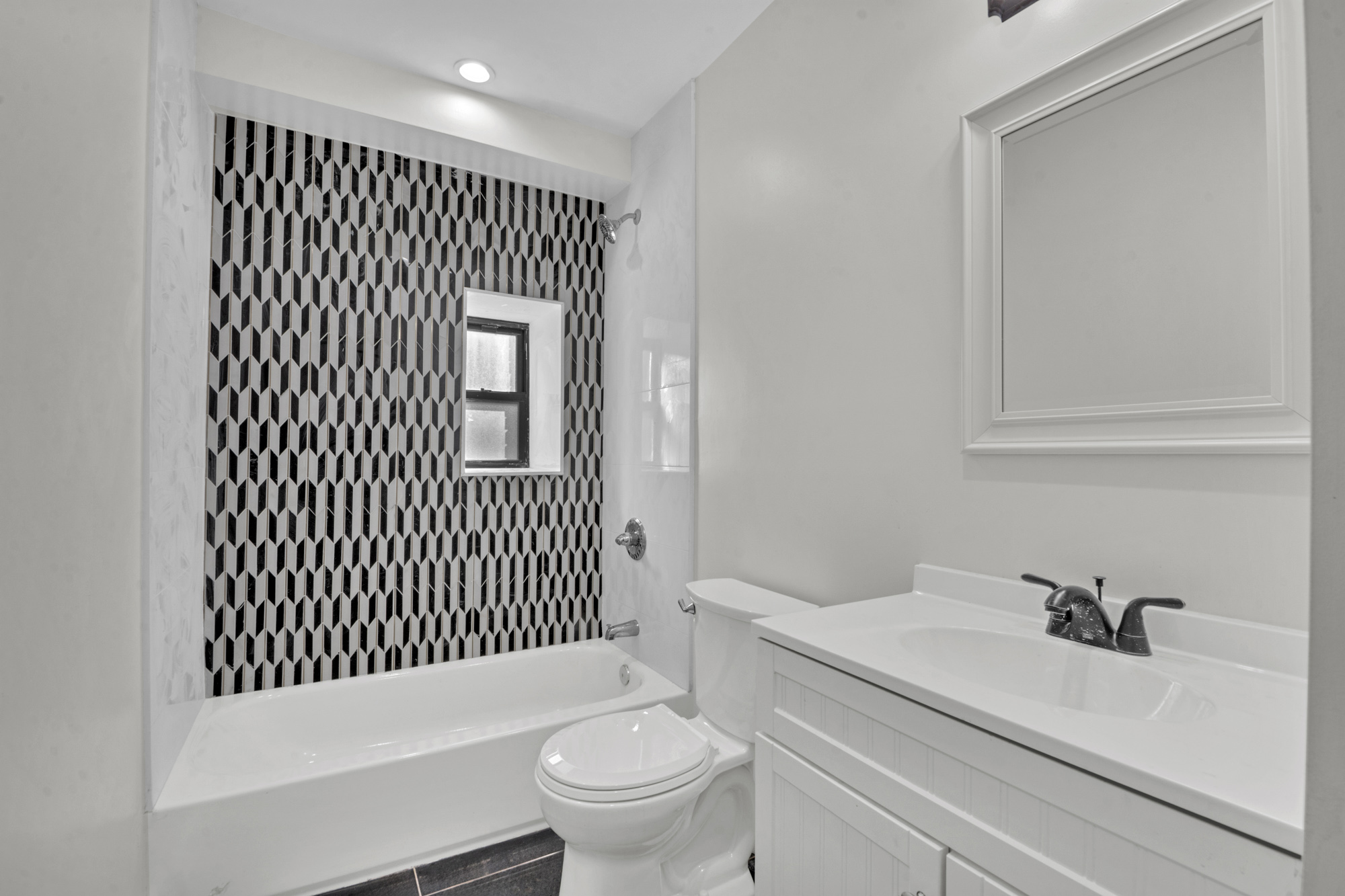 31 Roosevelt Place, Unit 1A Brooklyn, NY 11233 - Photo 7 of 14 a bathroom with a sink toilet and shower