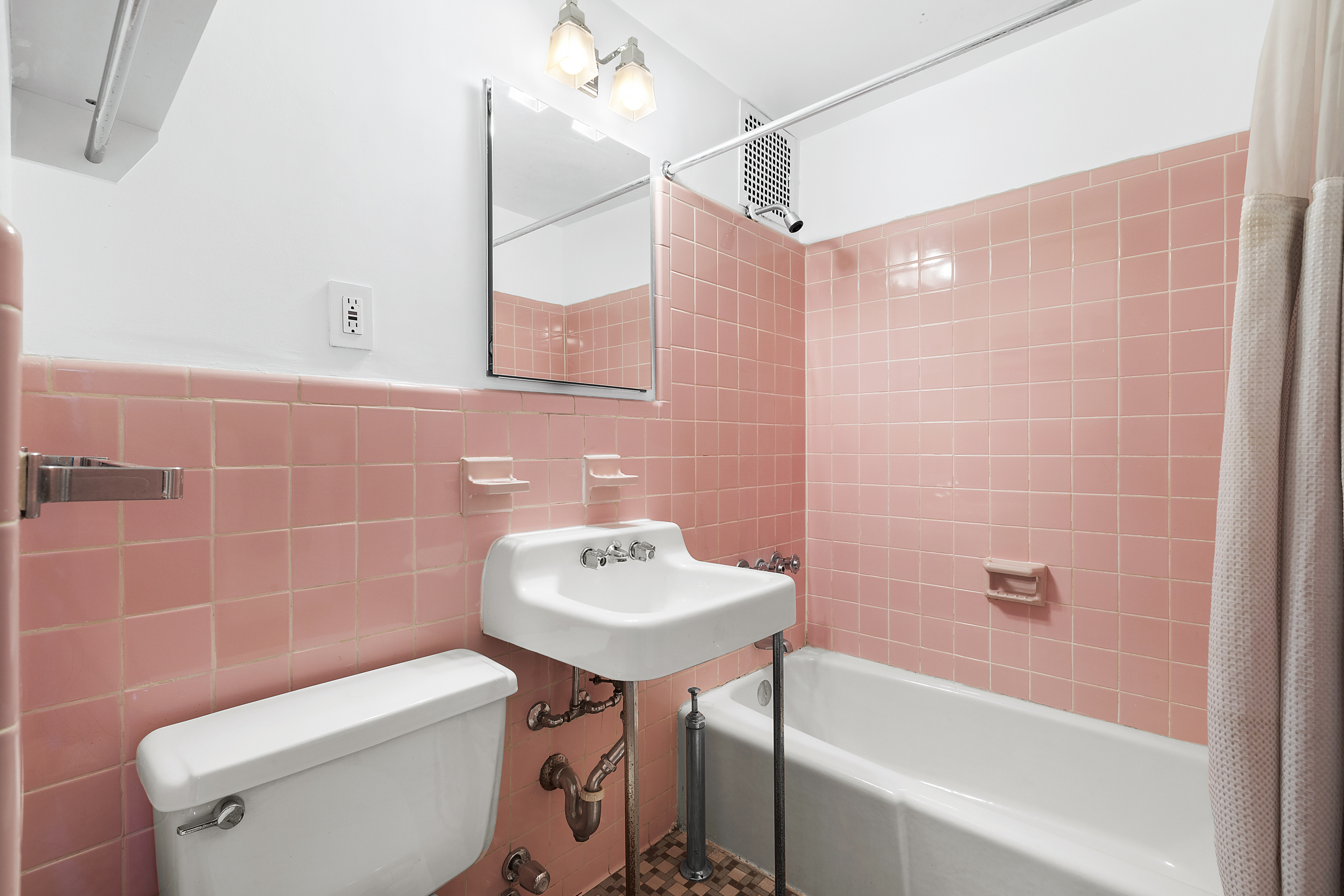 155 West 95th Street, Unit 6 Manhattan, NY 10025 - Photo 4 of 7 a bathroom with a sink a toilet a mirror and bathtub