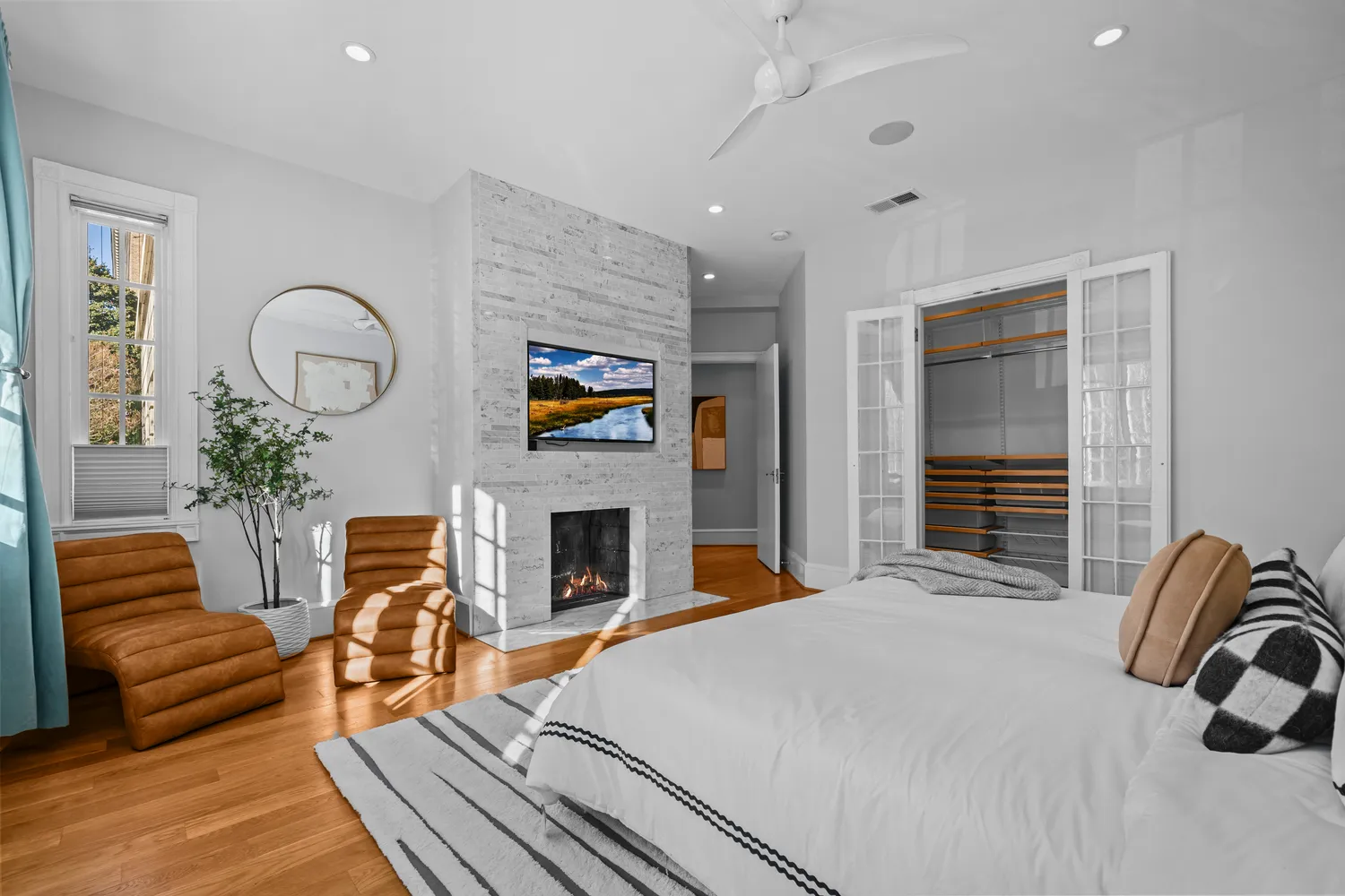 a bedroom with furniture and a fireplace