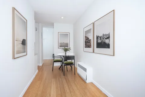 a view of a livingroom with furniture and wooden floor