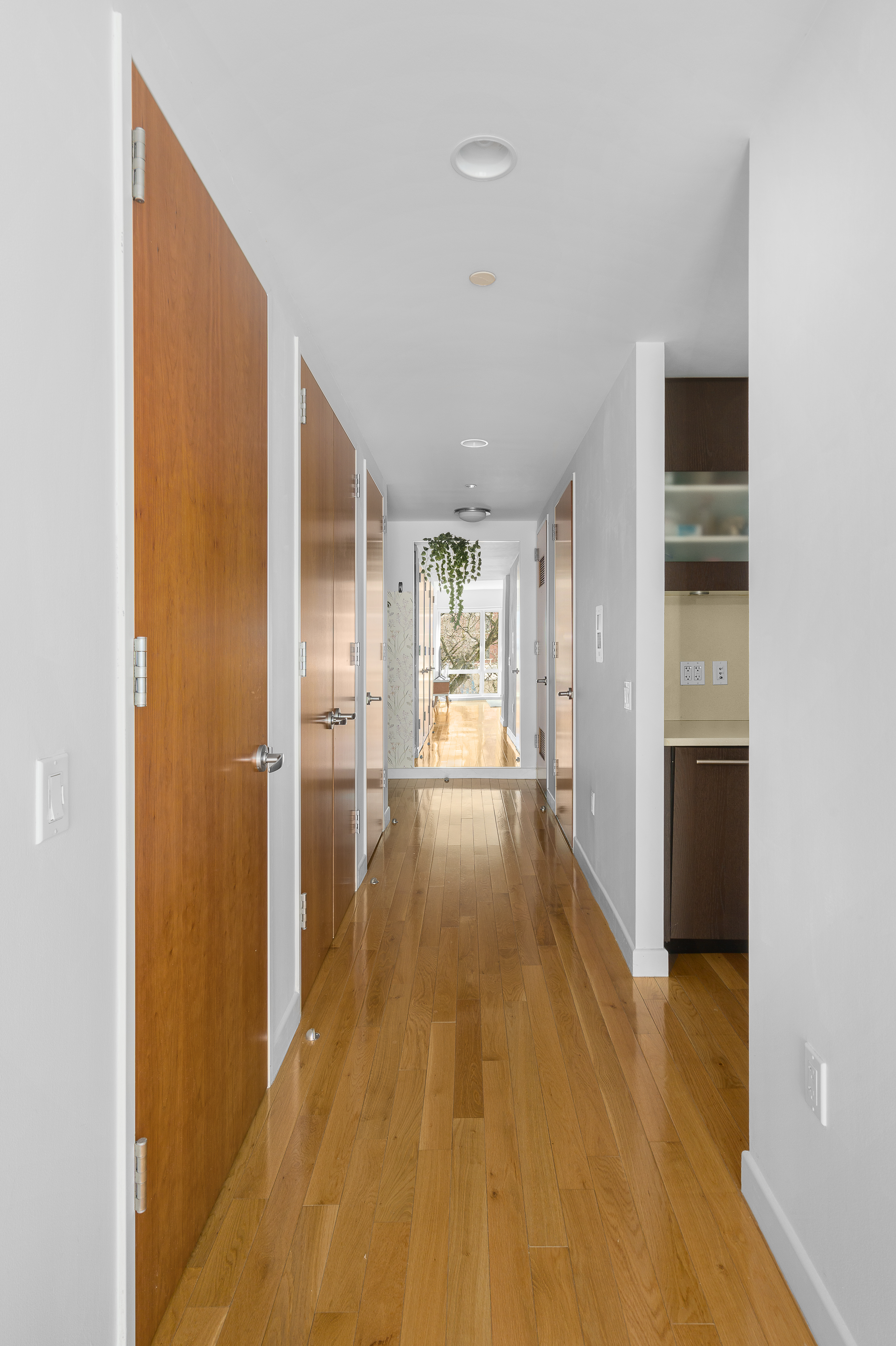 454 West 54th Street, Unit 3N Manhattan, NY 10019 - Photo 4 of 7 a view of hallway with wooden floor
