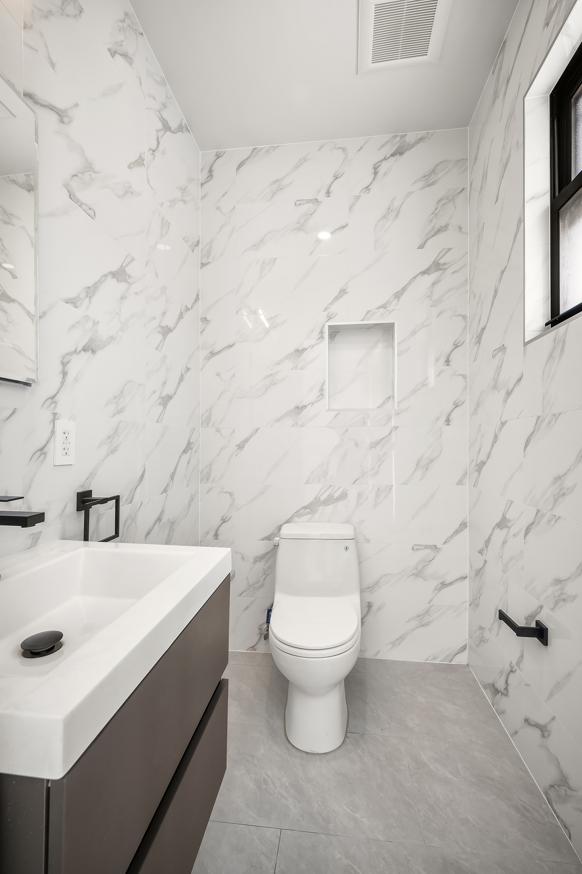 61 West 70th Street, Unit PH Manhattan, NY 10023 - Photo 17 of 18 a bathroom with a sink a toilet and mirror