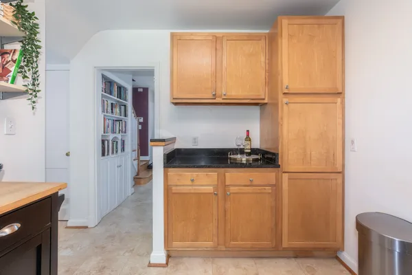 a kitchen with stainless steel appliances granite countertop a refrigerator and a stove