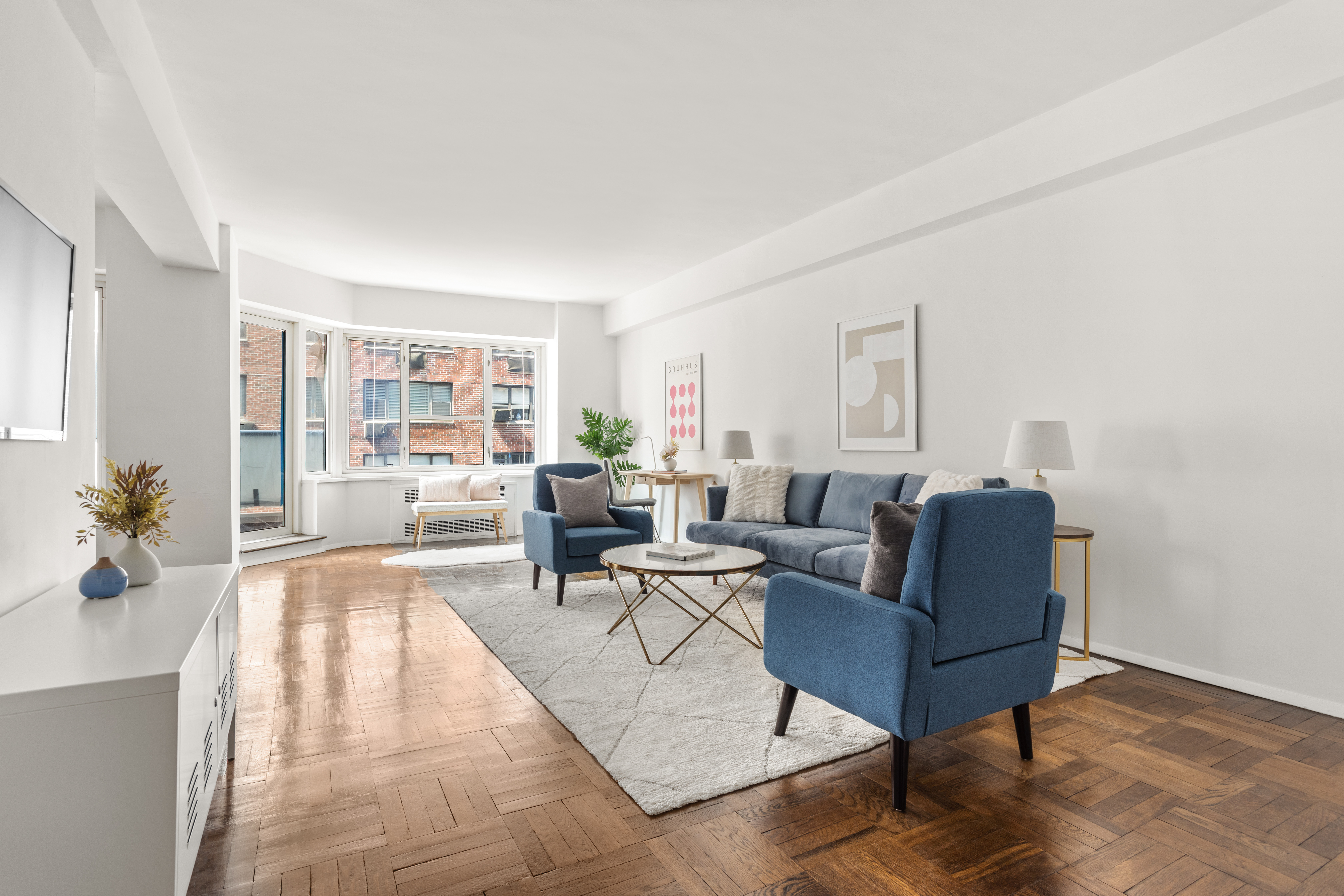 a living room with furniture and a table