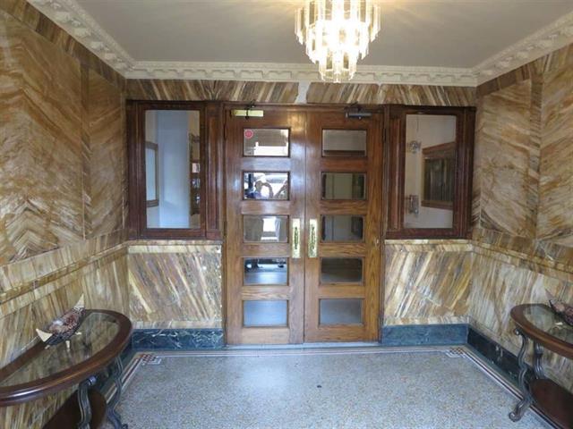 84 Washington Street, Unit 2E Hoboken, NJ 07030 - Photo 3 of 5 a view of a livingroom with a fireplace