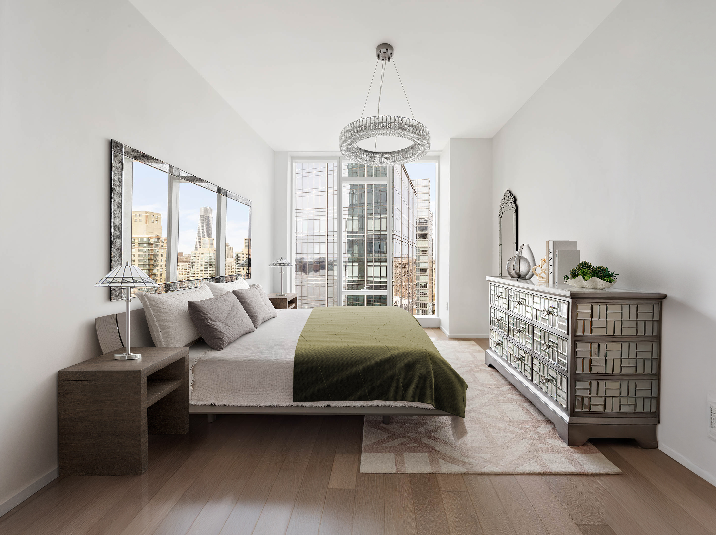 30 Riverside Boulevard, Unit 33D Manhattan, NY 10069 - Photo 6 of 18 a bedroom with a bed and a chandelier