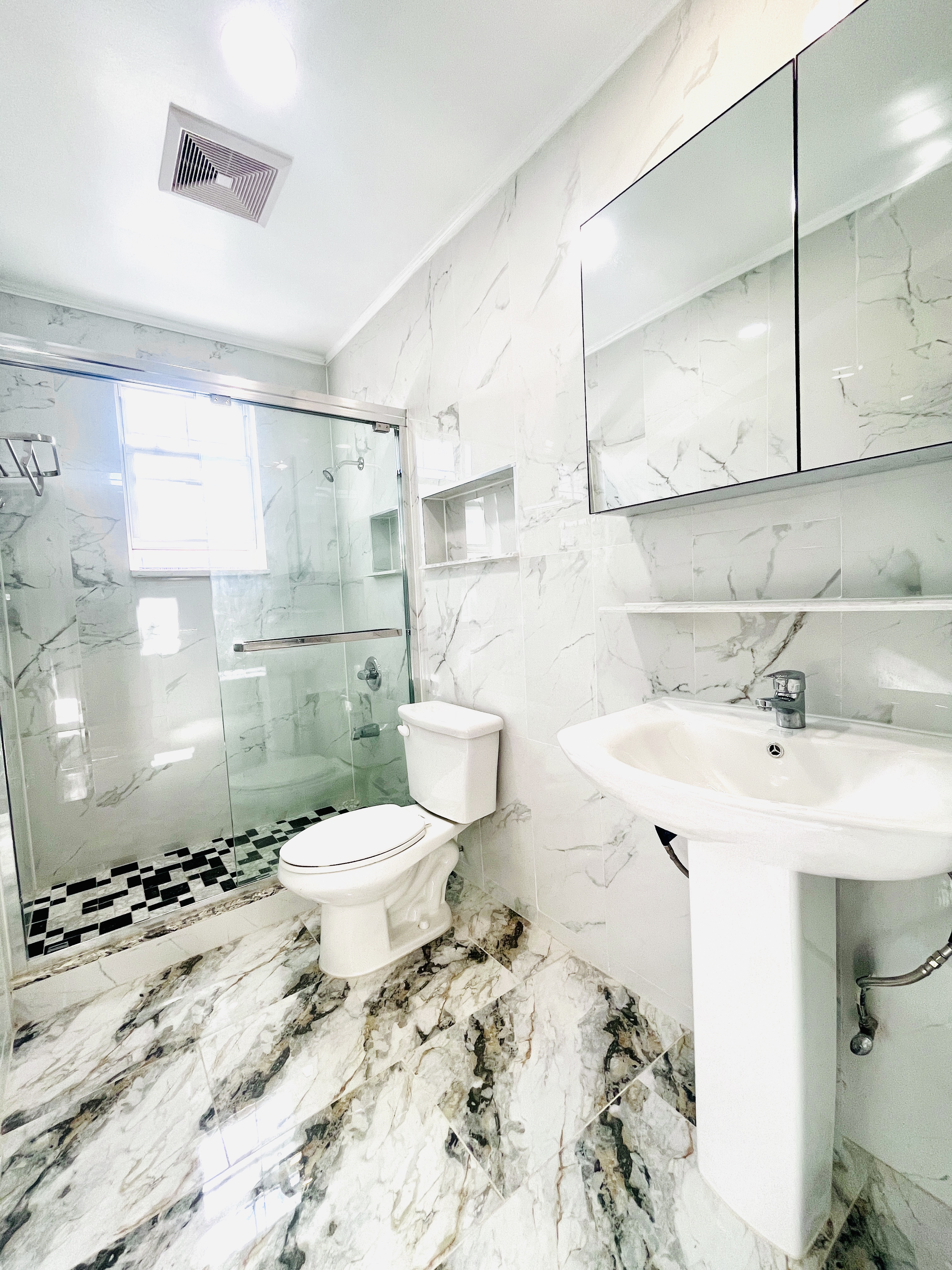 63-33 Haring Street, Unit 2F Queens, NY 11374 - Photo 7 of 7 a bathroom with a sink toilet and shower
