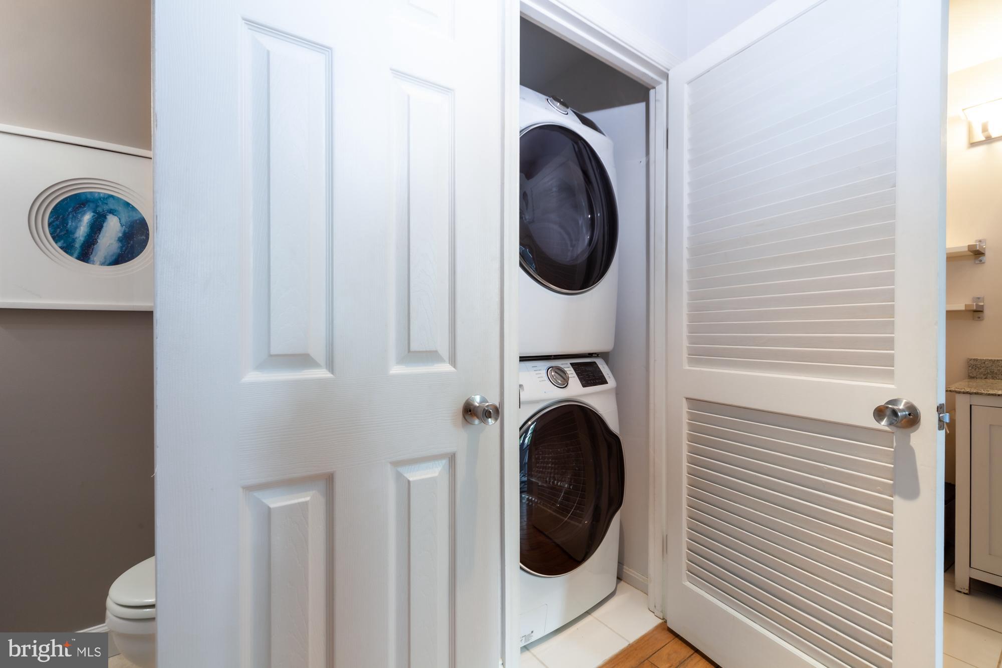 1715 15th Street Northwest, Unit 101 Washington, DC 20009 - Photo 10 of 23 a close view of a utility room with dryer and washer