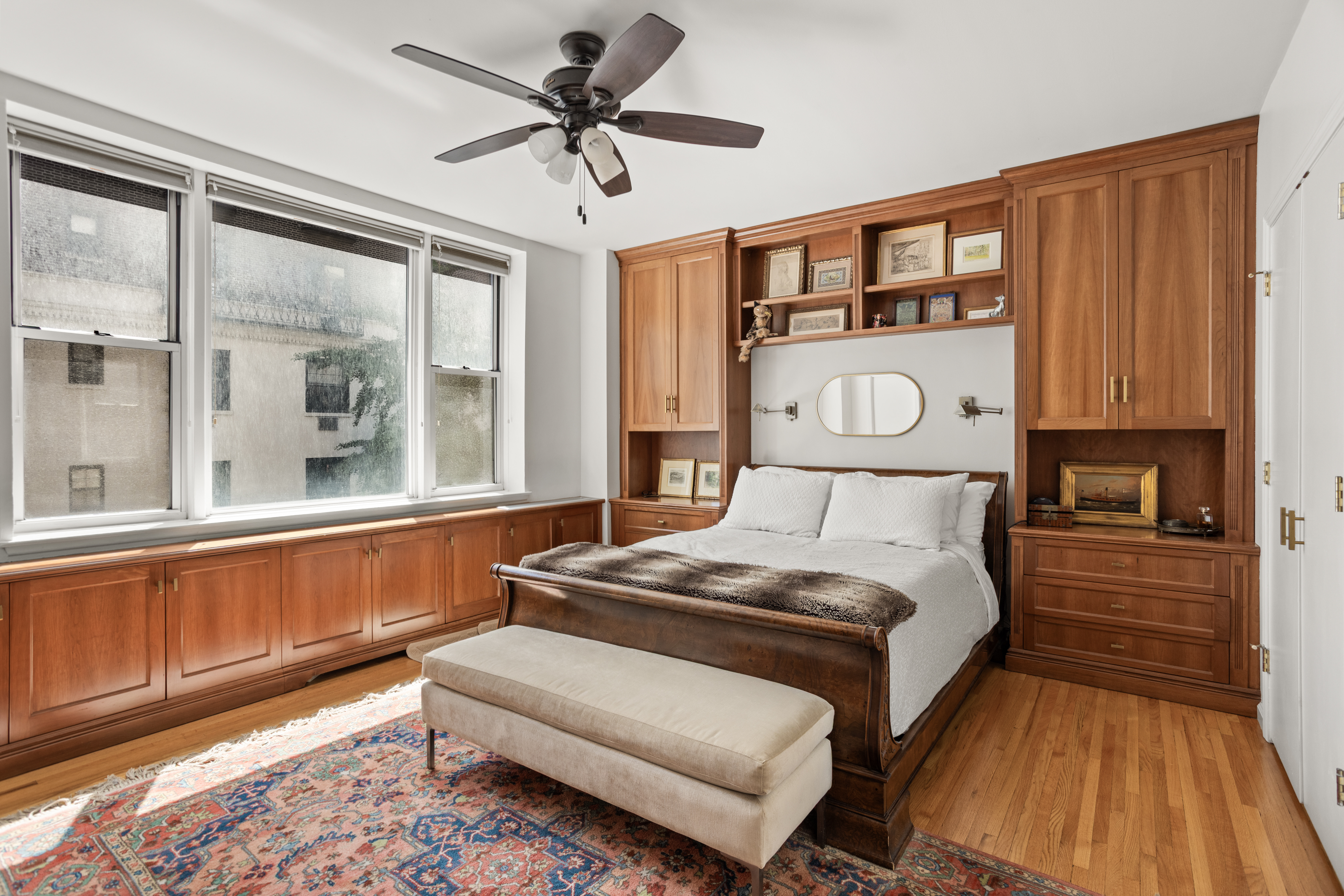 161 East 90th Street, Unit 3B Manhattan, NY 10128 - Photo 4 of 11 a bedroom with a bed couch and a window