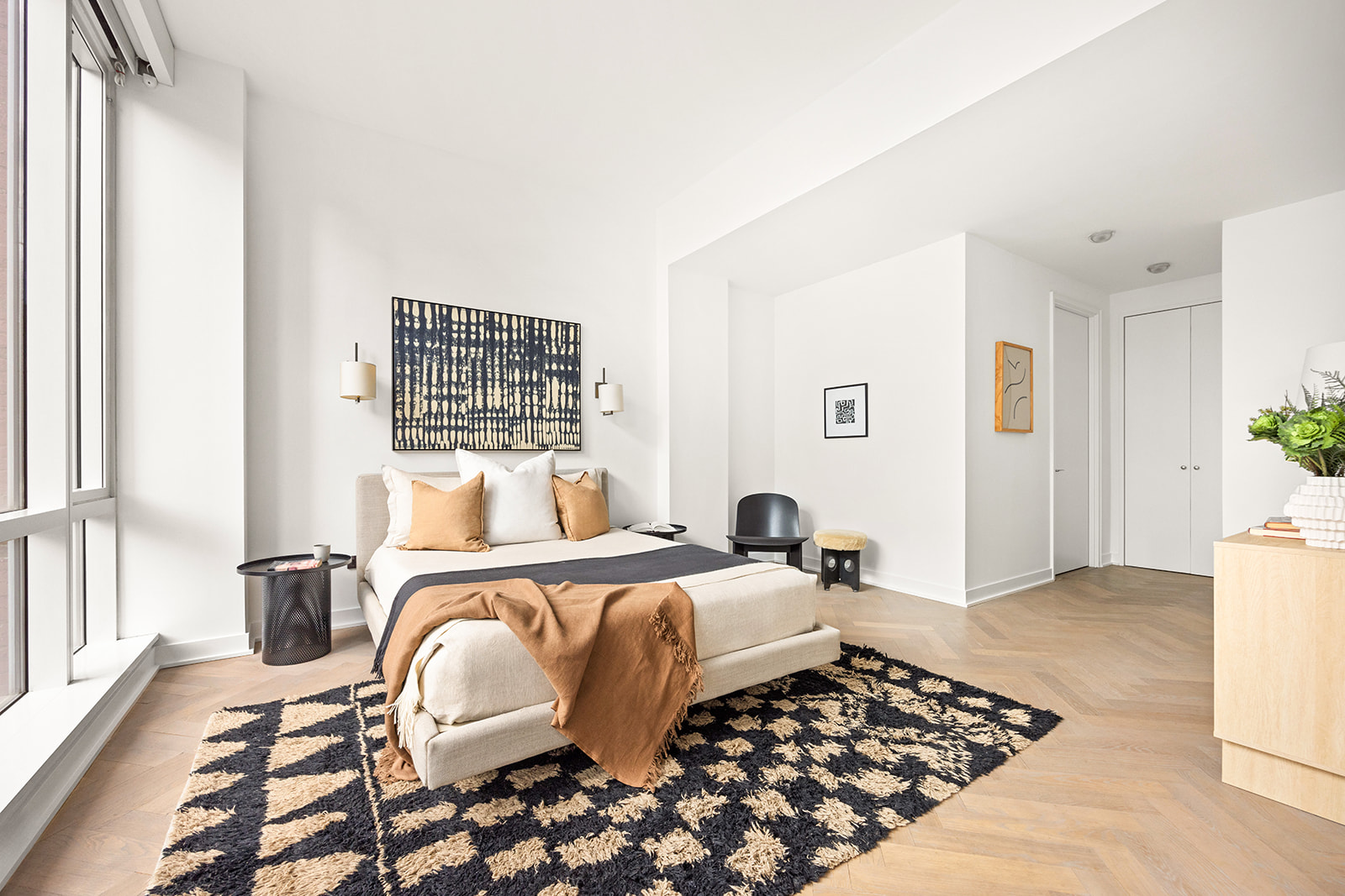 330 Spring Street, Unit 7D Manhattan, NY 10013 - Photo 9 of 11 a bedroom with a bed and a window