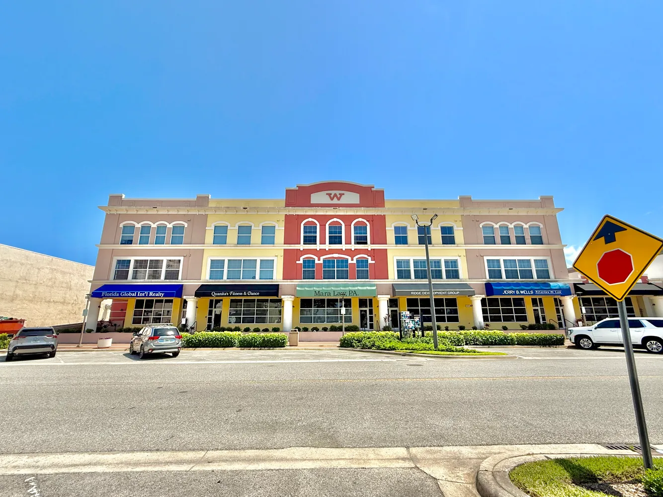 a front view of a building with street view