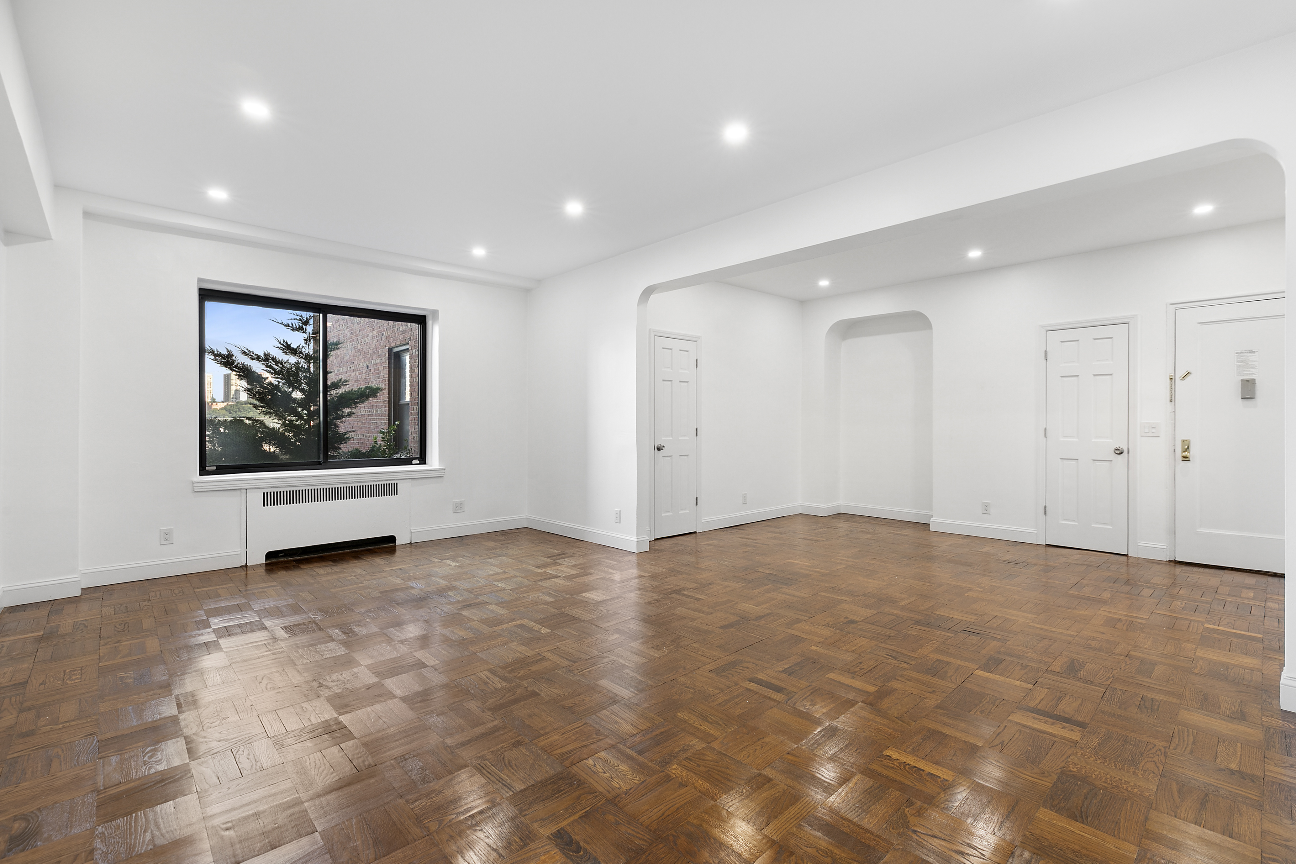159-34 Riverside Drive West, Unit 1J90 Manhattan, NY 10032 - Photo 3 of 19 a view of an empty room