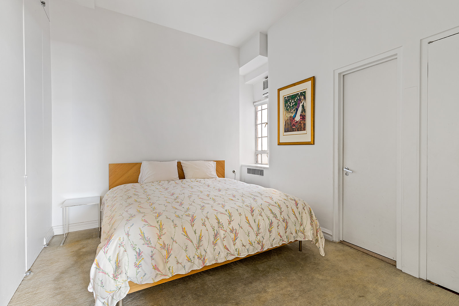 11 West 81st Street, Unit 6A Manhattan, NY 10024 - Photo 7 of 13 a bedroom with a bed and wall painting