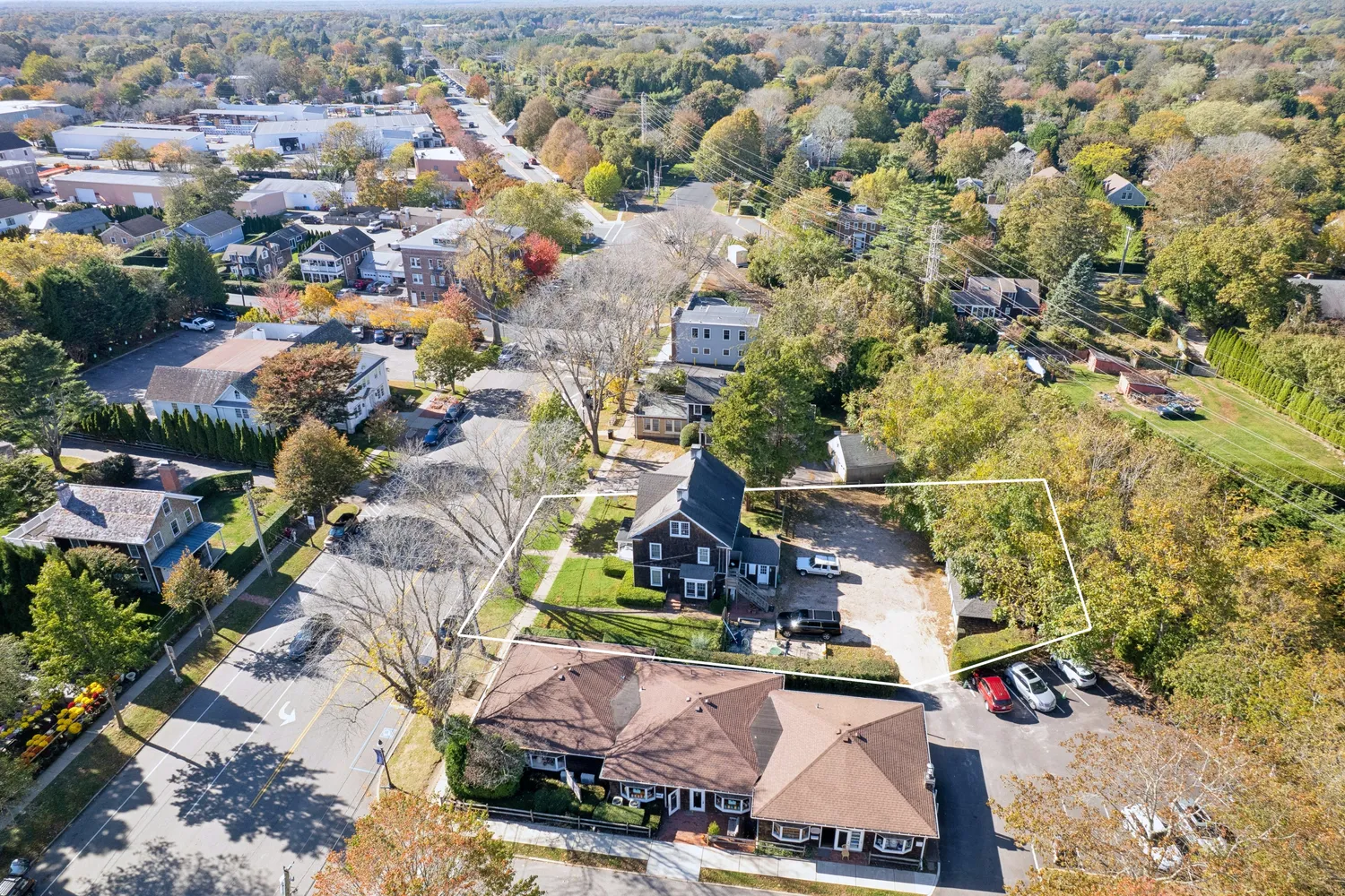 an aerial view of residential houses with outdoor space