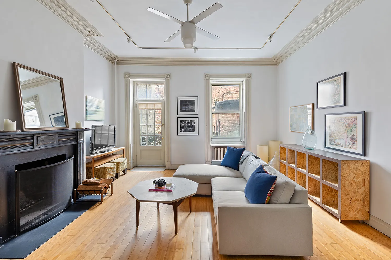 a living room with furniture and a fireplace