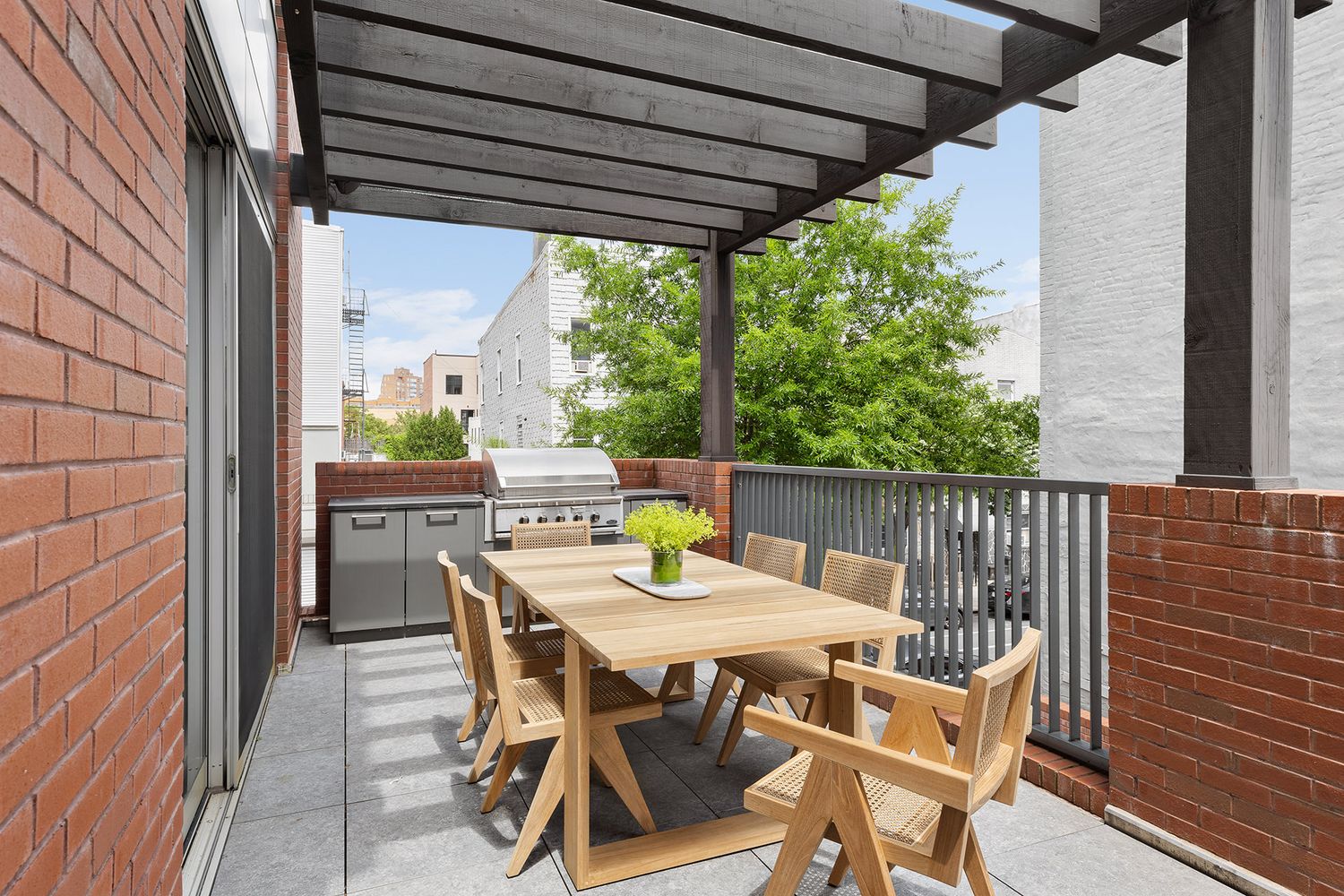 a view of an outdoor sitting area with furniture