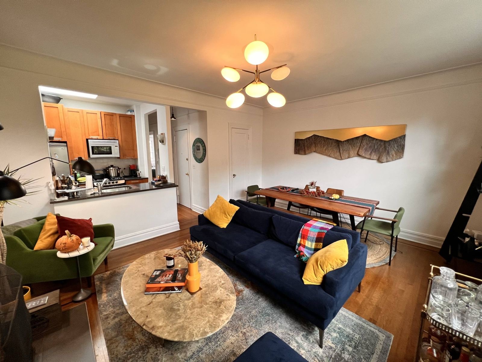 73 Perry Street, Unit 5 Manhattan, NY 10014 - Photo 4 of 10 a living room with furniture and a dining room