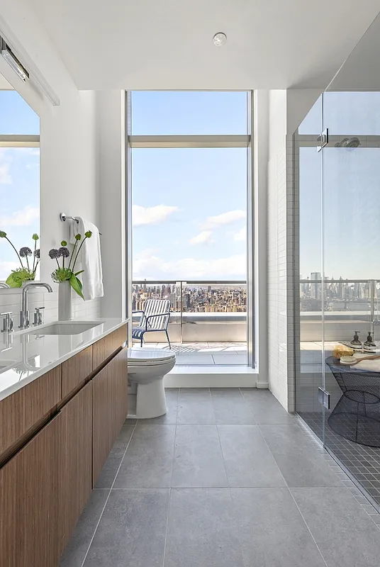 5 South 5th Street, Unit PH2B Brooklyn, NY 11249 - Photo 8 of 27 a bathroom with a granite countertop sink and a large mirror