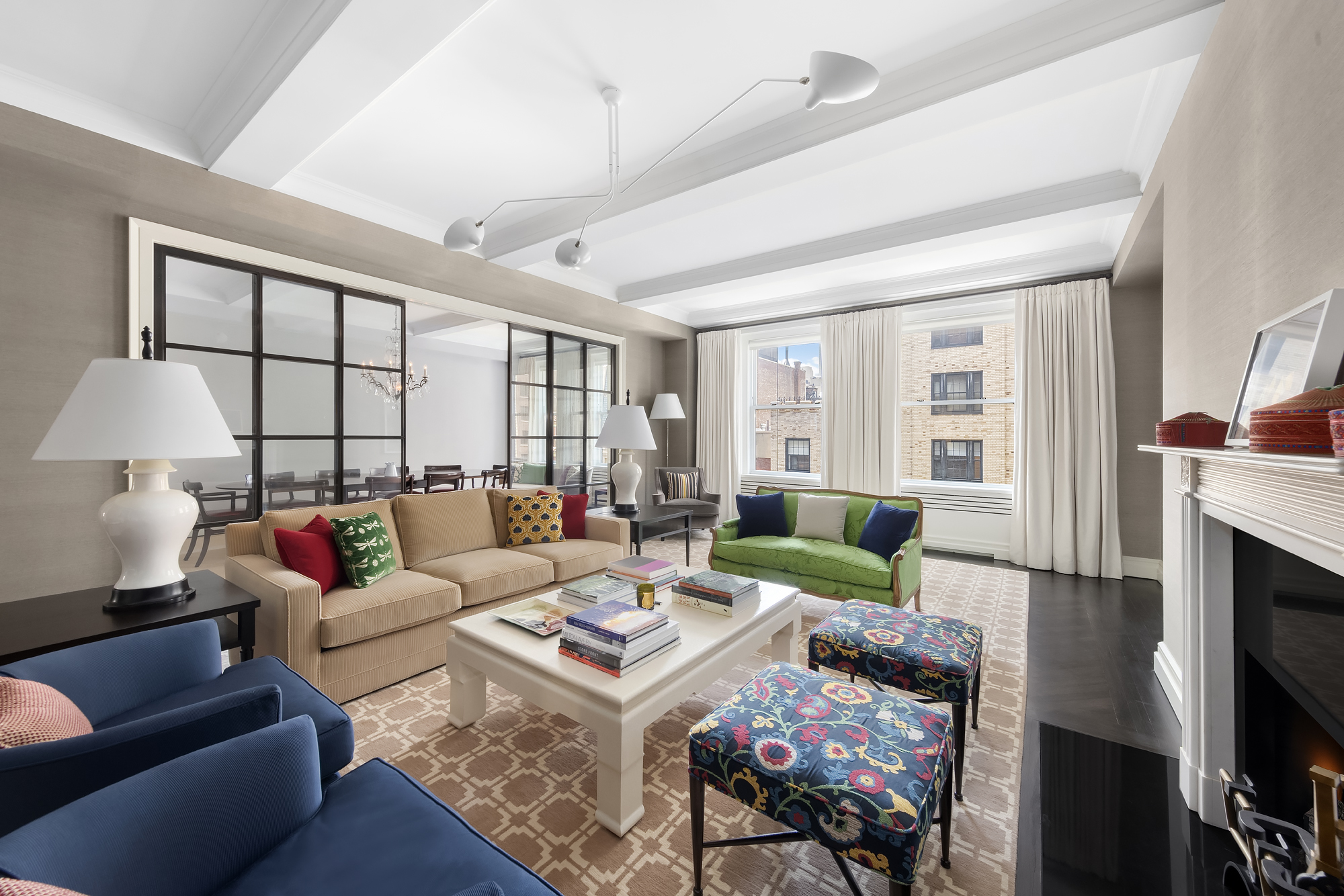33 East 70th Street, Unit 6F Manhattan, NY 10021 - Photo 1 of 13 a living room with furniture fireplace and a large window