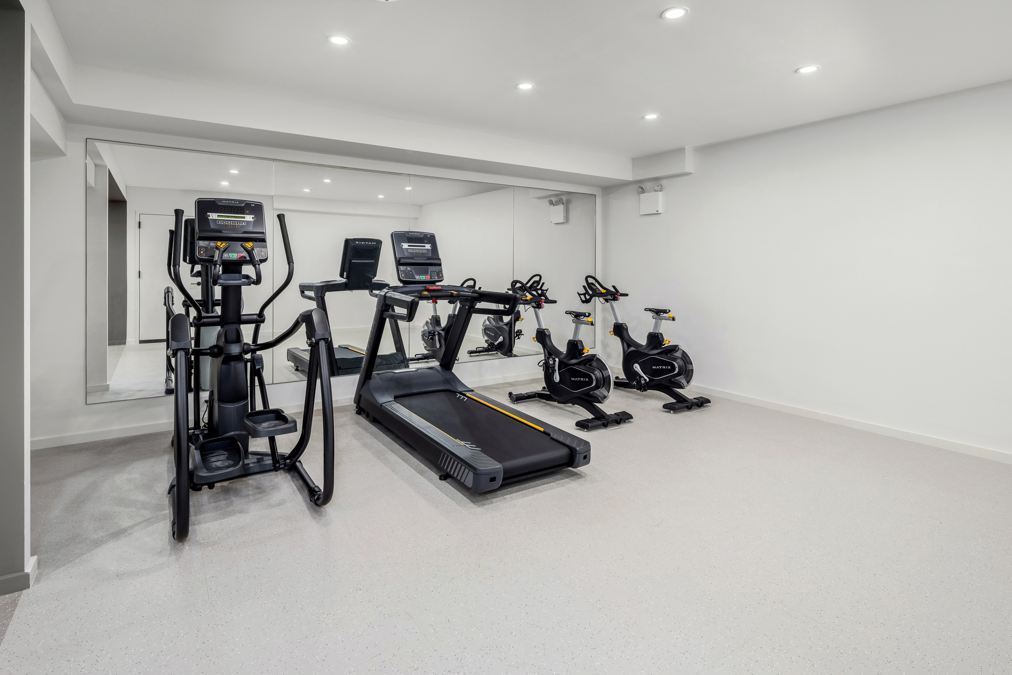 66 Clinton Street, Unit 6B Manhattan, NY 10002 - Photo 14 of 16 a view of a room with gym equipment