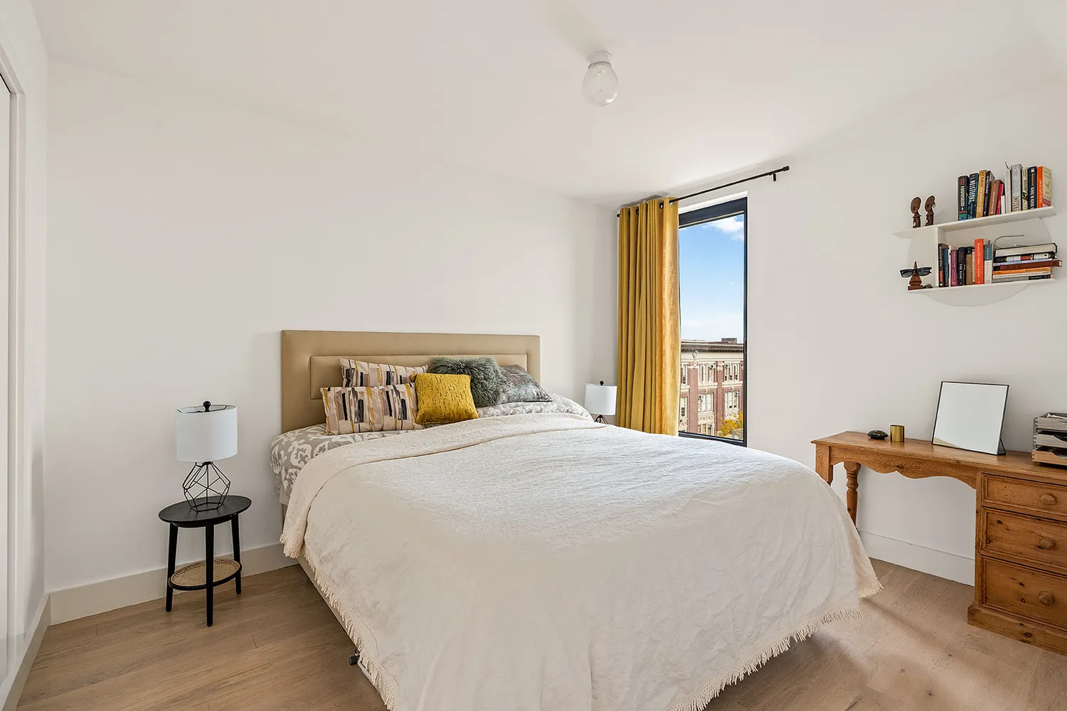 a bedroom with a bed and a table in it