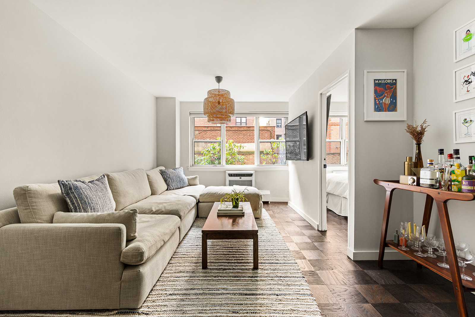 333 East 79th Street, Unit 1R Manhattan, NY 10075 - Photo 2 of 12 a living room with furniture and a large window